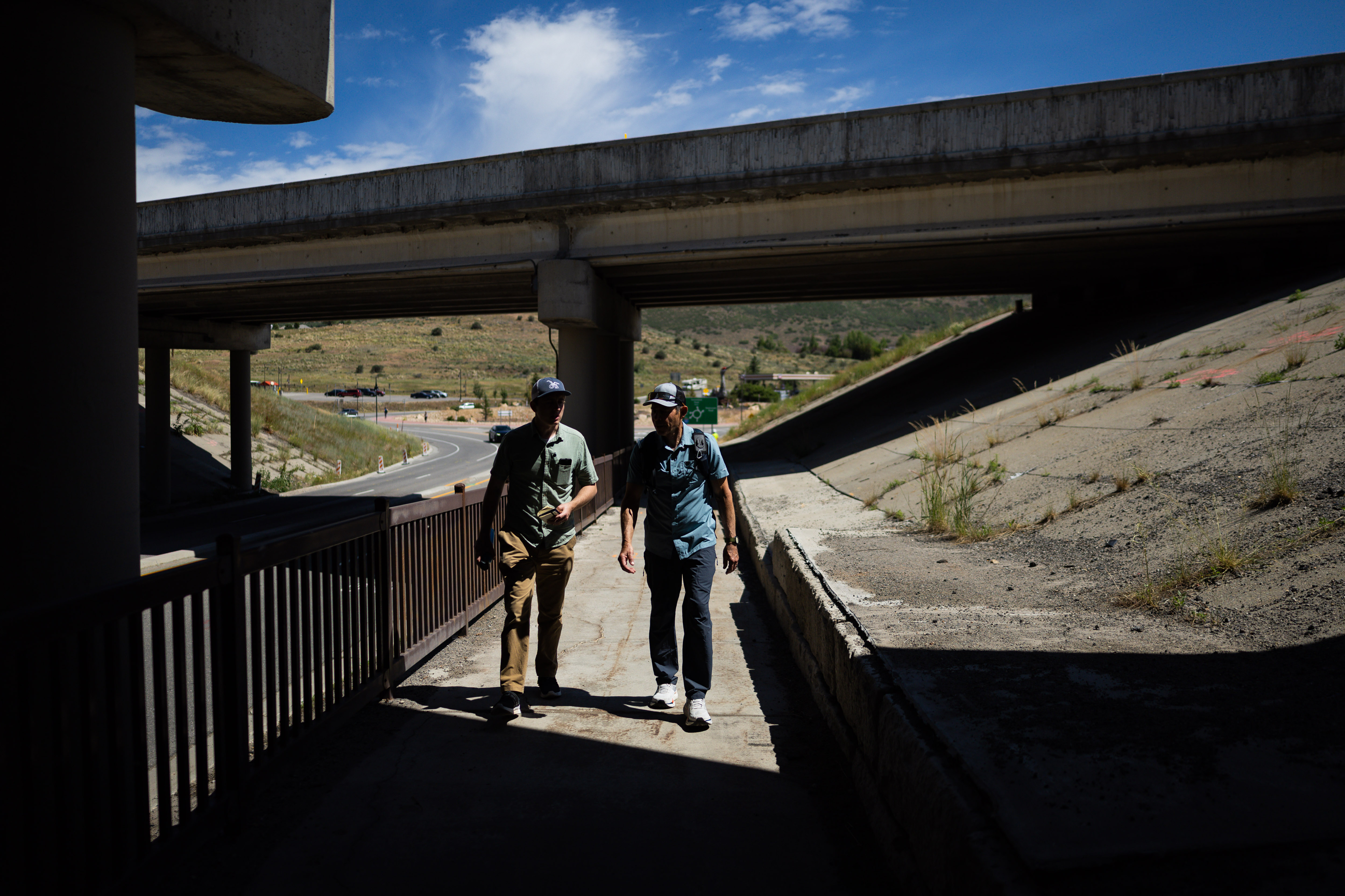 Sen. John Curtis, R-Utah, right, talks with Deseret News reporter Brigham Tomco, left, while walking a 4-mile stretch from above Jeremy Ranch to Kimball Junction in Park City on Wednesday, as a part of his America 250 walk from Bear Lake to the Stadium of Fire. The walk follows a 250-mile continuous route over the course of nine days.