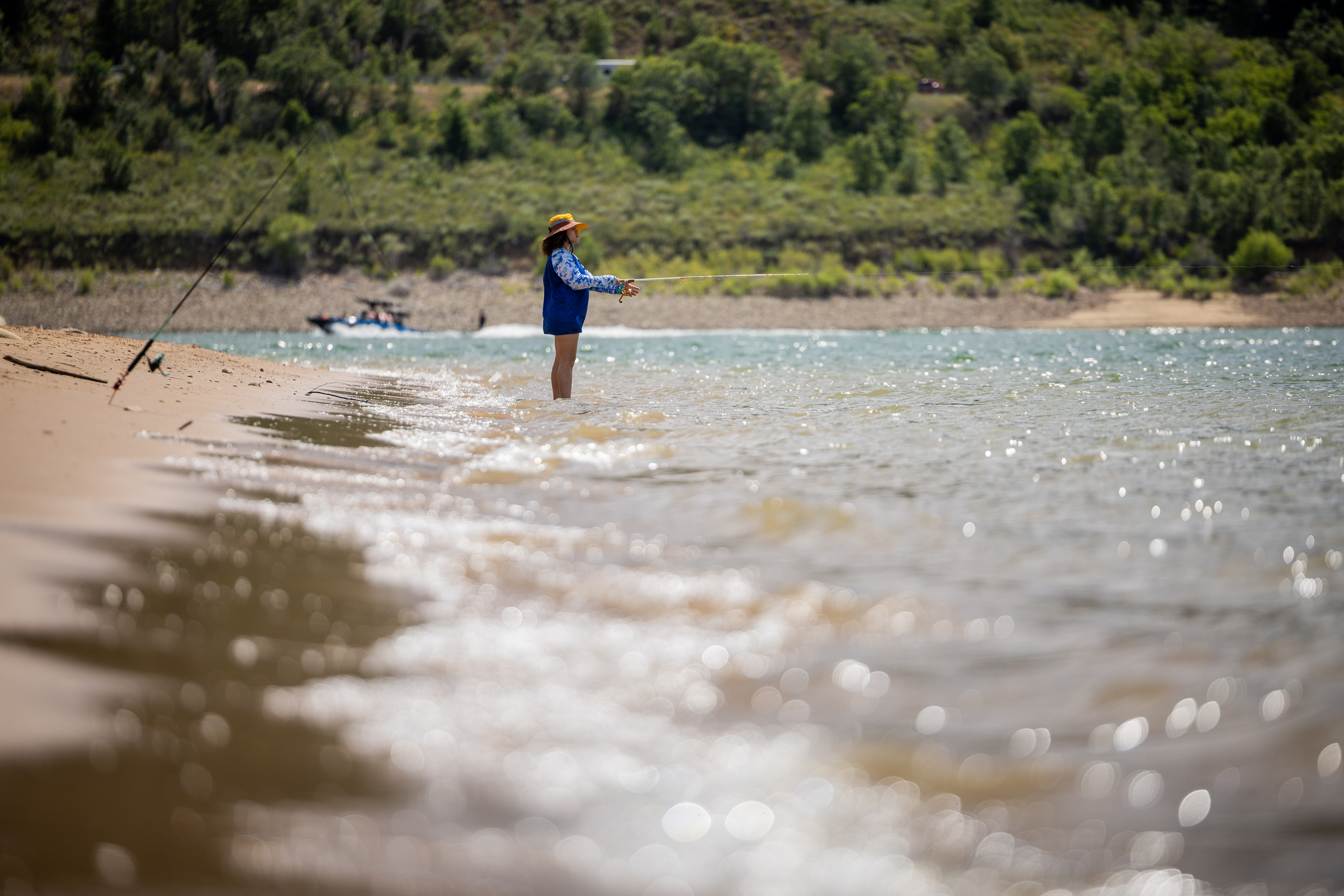 Cristal Watts, from Clinton, fishes at Pineview Reservoir in Ogden Valley on Thursday. The Utah Division of Wildlife Resources increased fishing limits at the reservoir as a result, as well as at six other bodies of water in Utah, on Thursday.