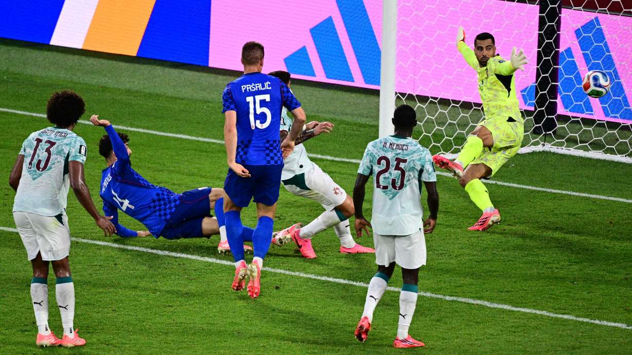 Croatia's Josko Gvardiol (4) scores a goal against Portugal goalkeeper Diego Costa (1) that was later taken back due to an offside call, during the second half of a World Cup round of 32 soccer match, in Toronto on Thursday, July 2, 2026.