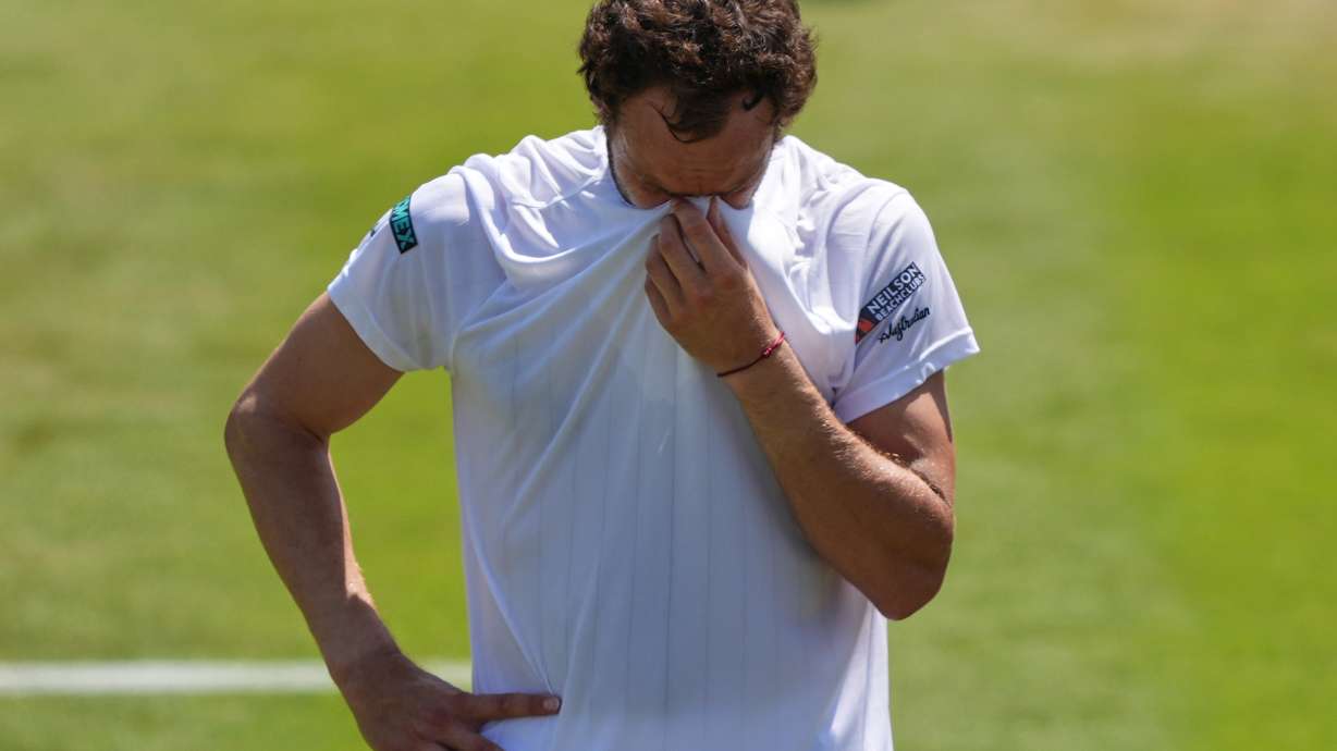 Roman Safiullin of Russia reacts winning the third round men's singles match against Joao Fonseca of Brazil at the Wimbledon Tennis Championships in London, Friday, July 3, 2026.