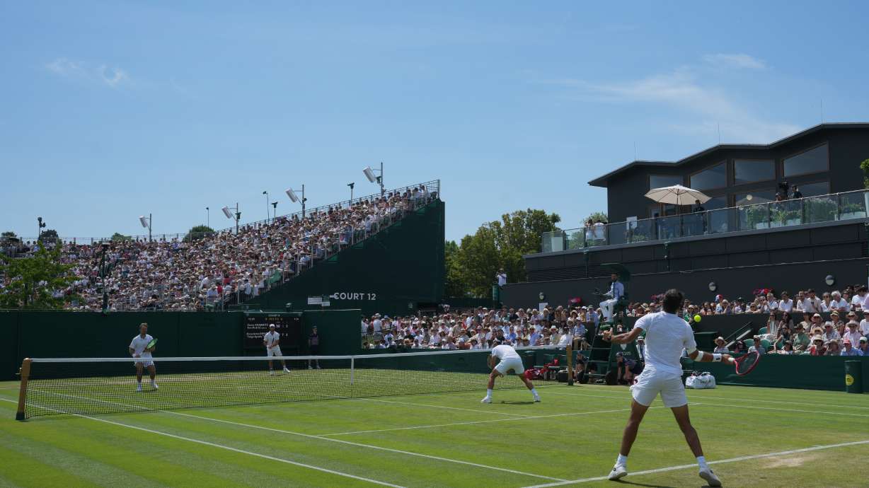 Kevin Krawietz and Tim Puetz of Germany, top, face Roman Andres Burruchaga and Thiago Agustin Tirante of Argentina in their second round men's doubles match, at the Wimbledon Tennis Championships in London, Friday, July 3, 2026.