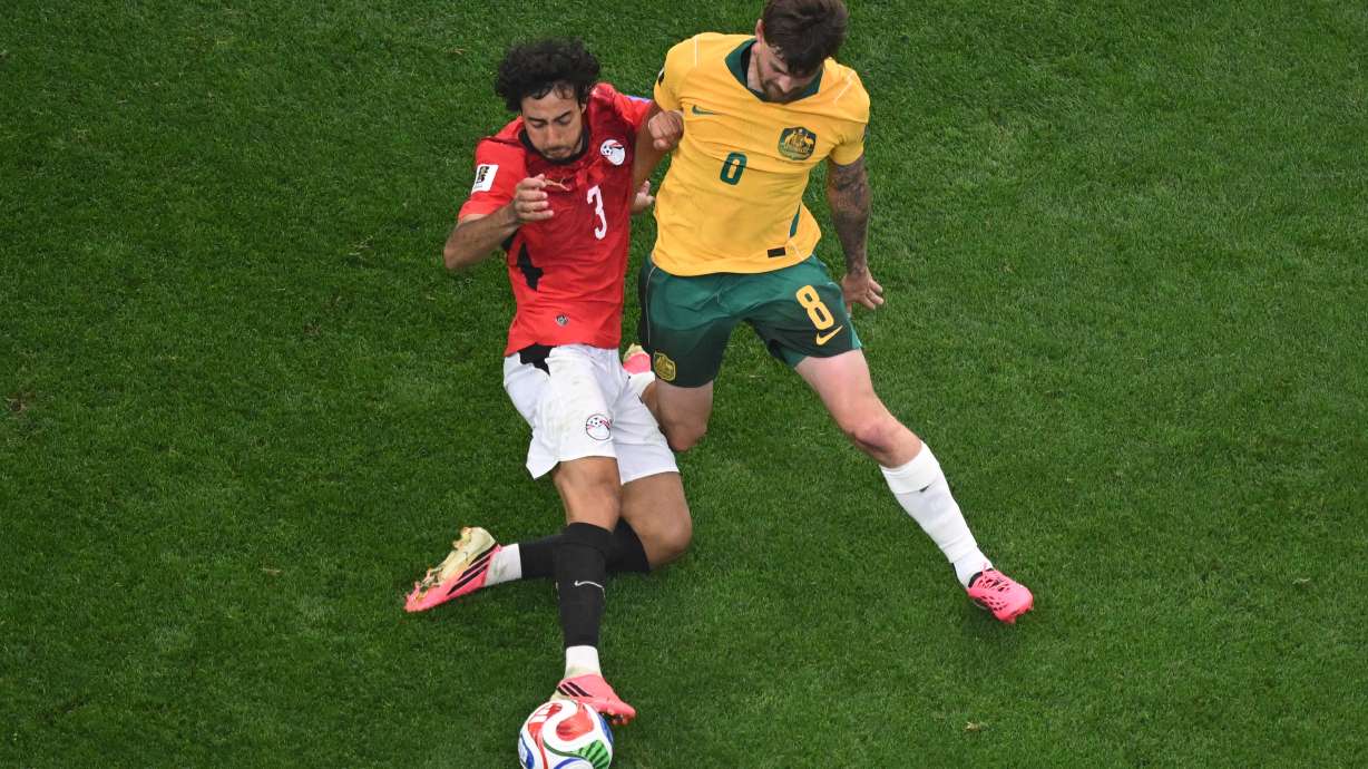 Egypt's Mohamed Hany (3) and Australia's Connor Metcalfe (8) fight for the ball during the World Cup round of 32 soccer match between Australia and Egypt in Arlington, Texas, near Dallas, Friday, July 3, 2026.