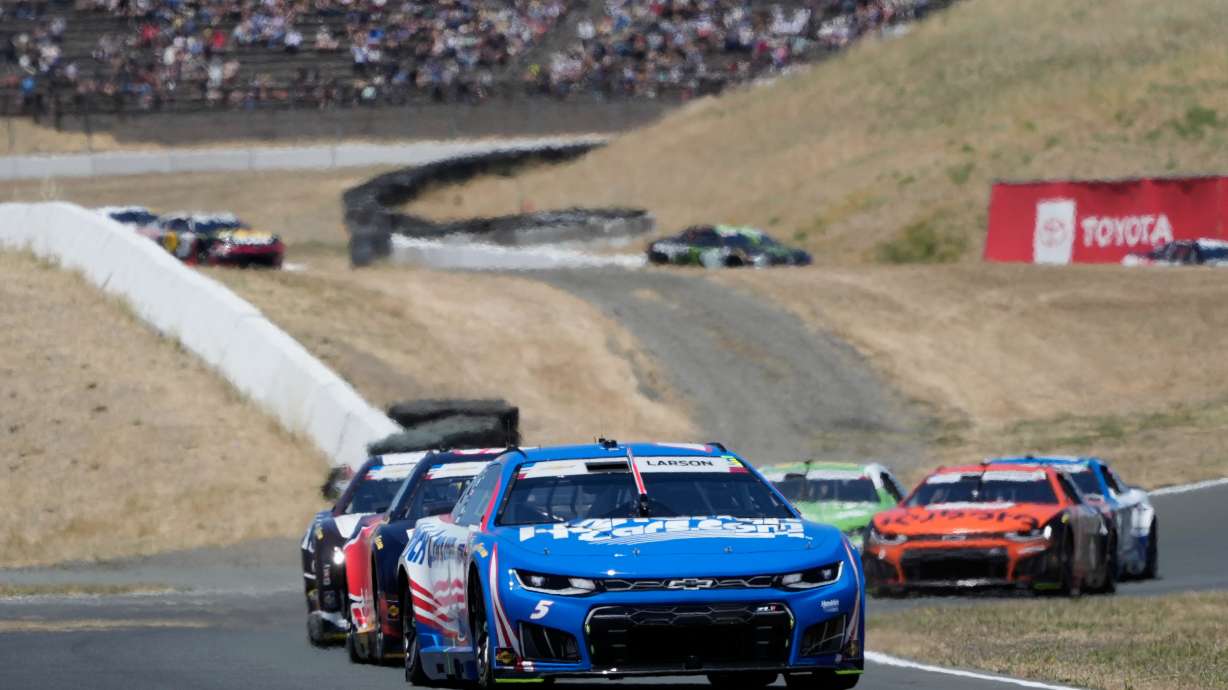 Kyle Larson, foreground, drives in front of cars during a NASCAR Cup Series auto race at Sonoma Raceway, Sunday, June 28, 2026, in Sonoma, Calif.
