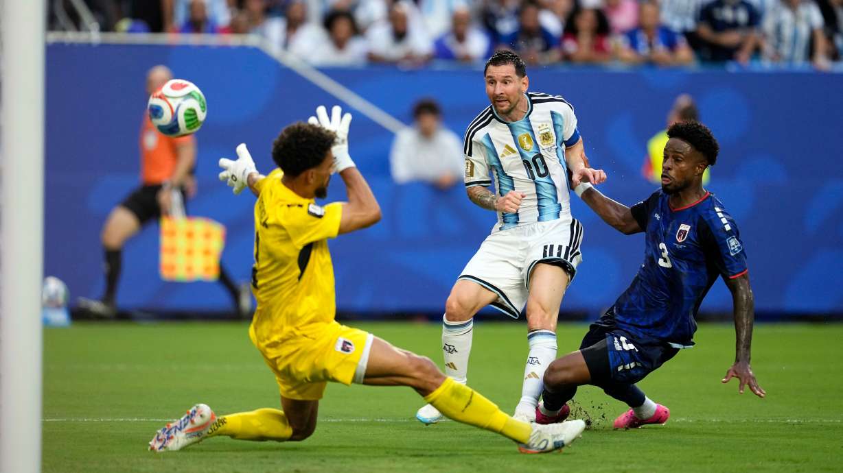 Argentina's Lionel Messi (10) scores their first goal against Cape Verde goalkeeper Vozinha (1) during the World Cup round of 32 soccer match between Argentina and Cape Verde in Miami Gardens, Fla., Friday, July 3, 2026.