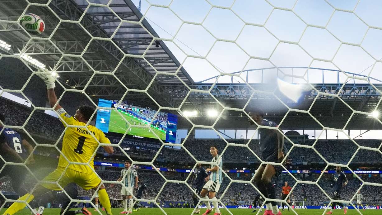 Cape Verde goalkeeper Vozinha (1) is scored on by Argentina's Lisandro Martinez during the World Cup round of 32 soccer match between Argentina and Cape Verde in Miami Gardens, Fla., Friday, July 3, 2026.