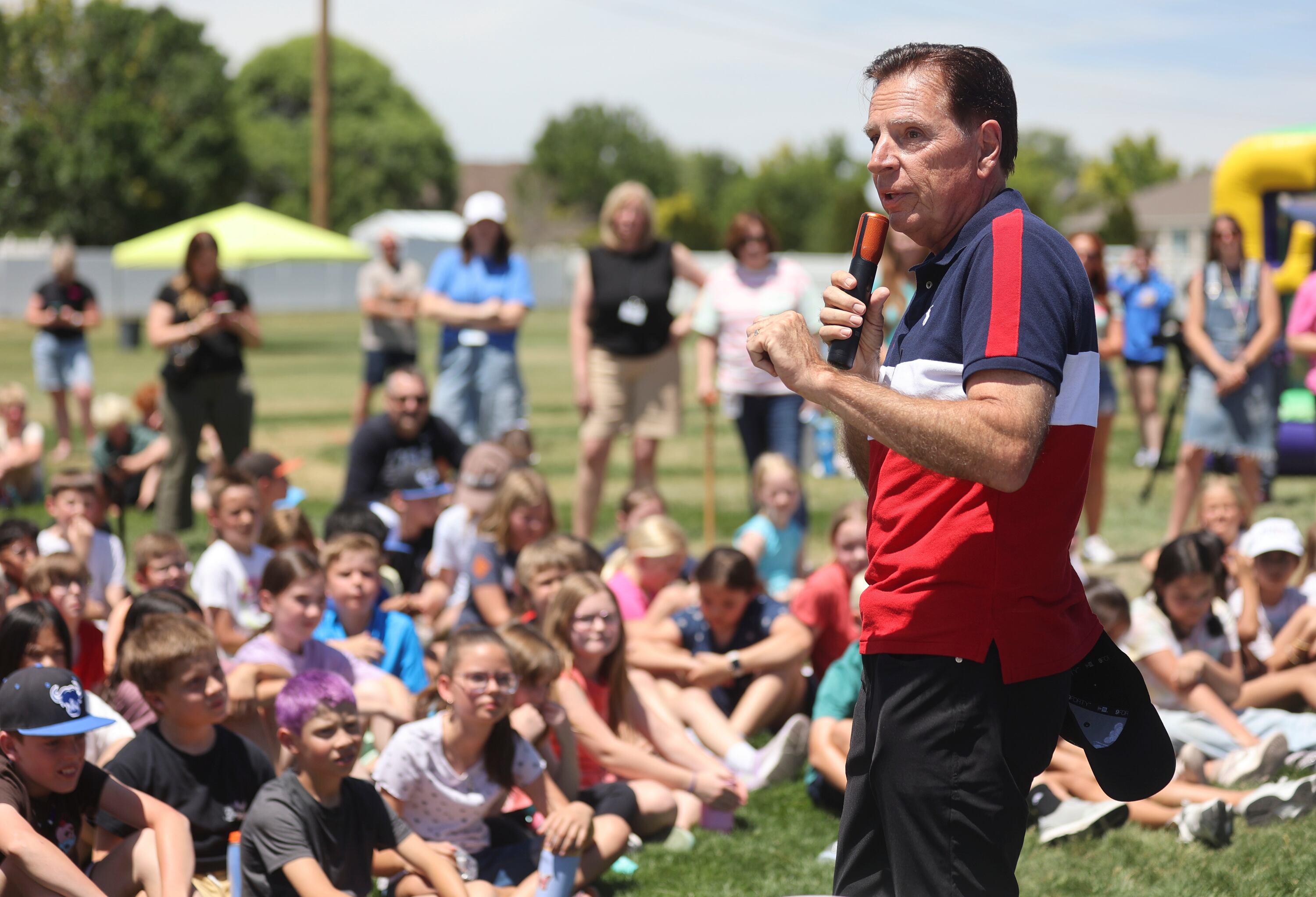 Fraser Bullock, president and executive chair of the Utah 2034 organizing committee, talks to students as Olympians and Paralympians join field day at South Jordan Elementary School on June 3. Bullock said he's excited about the potential changes coming to the Winter Olympics.