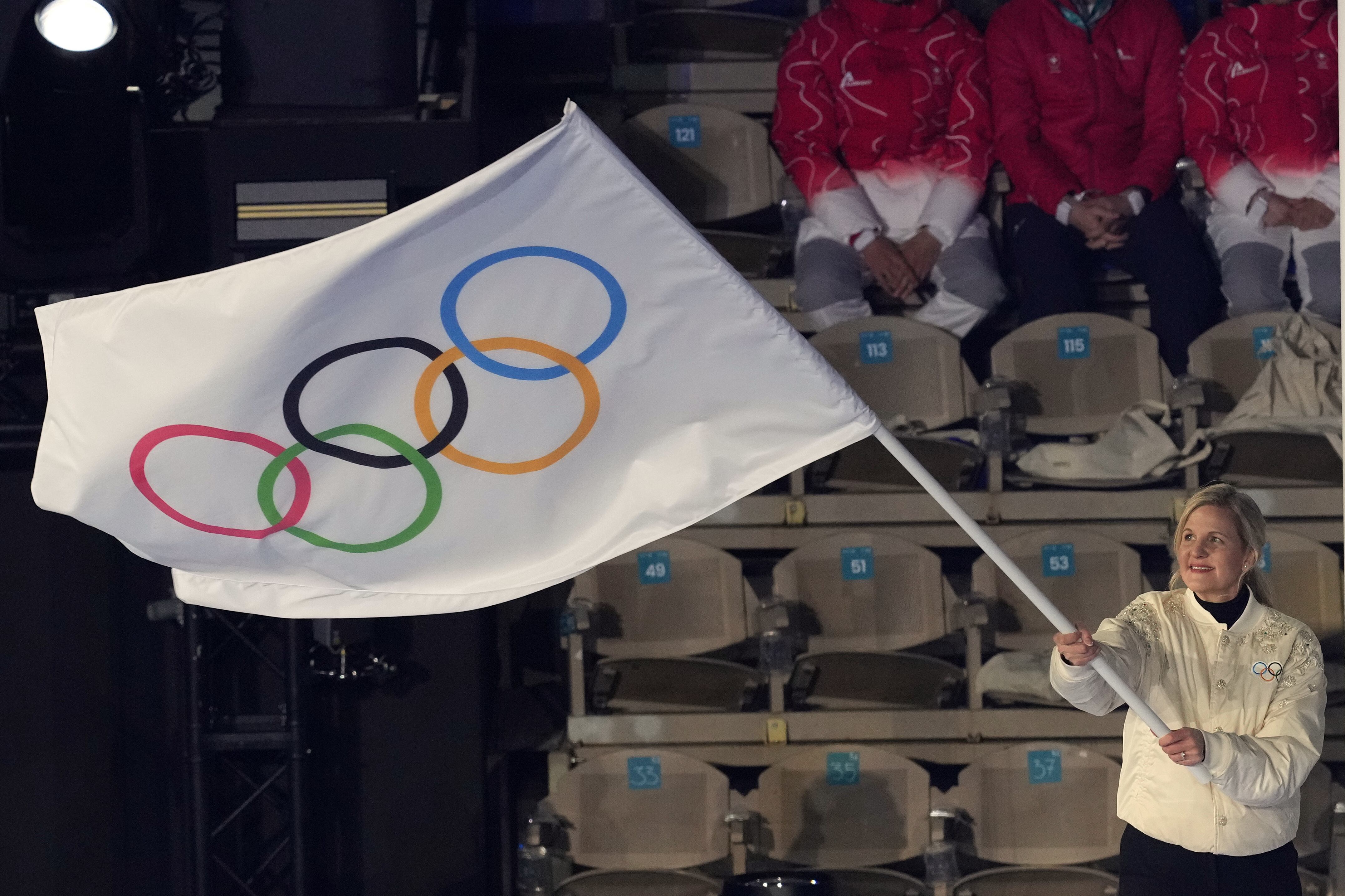 IOC President Kirsty Coventry waves the Olympic flag during the closing ceremony of the 2026 Winter Olympics, in Verona, Italy, Feb. 22. The IOC made several wide-ranging changes to future Olympics this week.