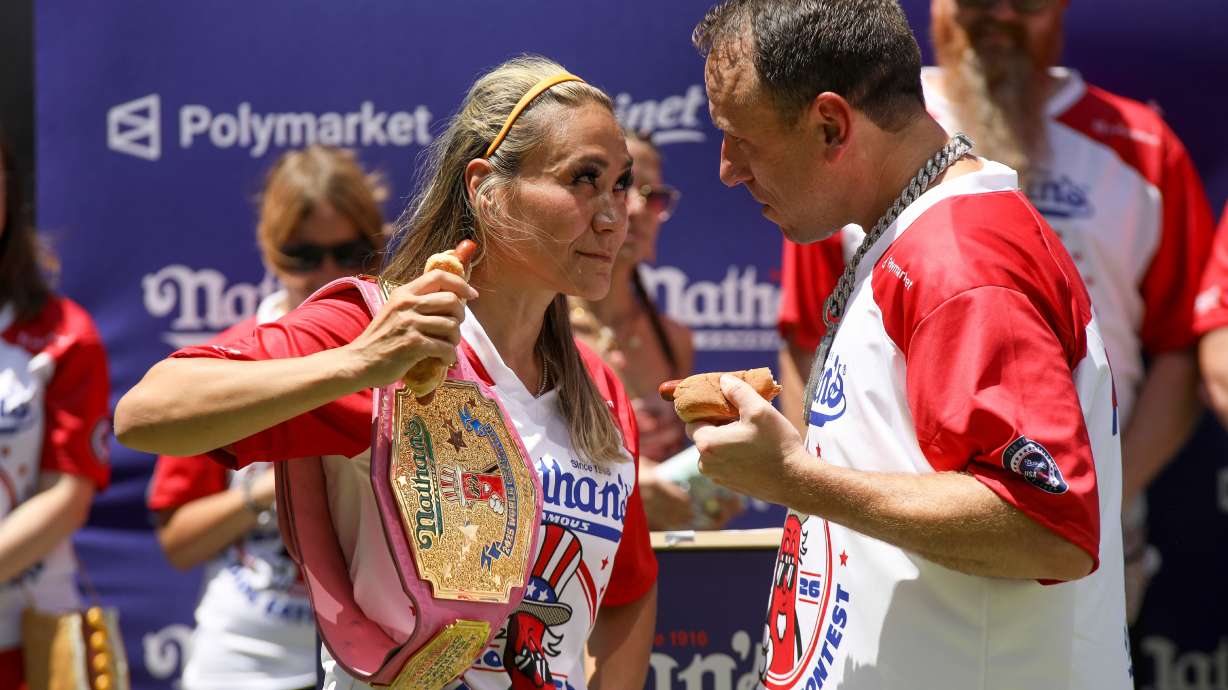Miki Sudo, left, and Joey Chestnut participate in the Nathan's Famous Fourth of July International Hot Dog Eating Contest weigh-in ceremony at Hudson Yards on Friday in New York.