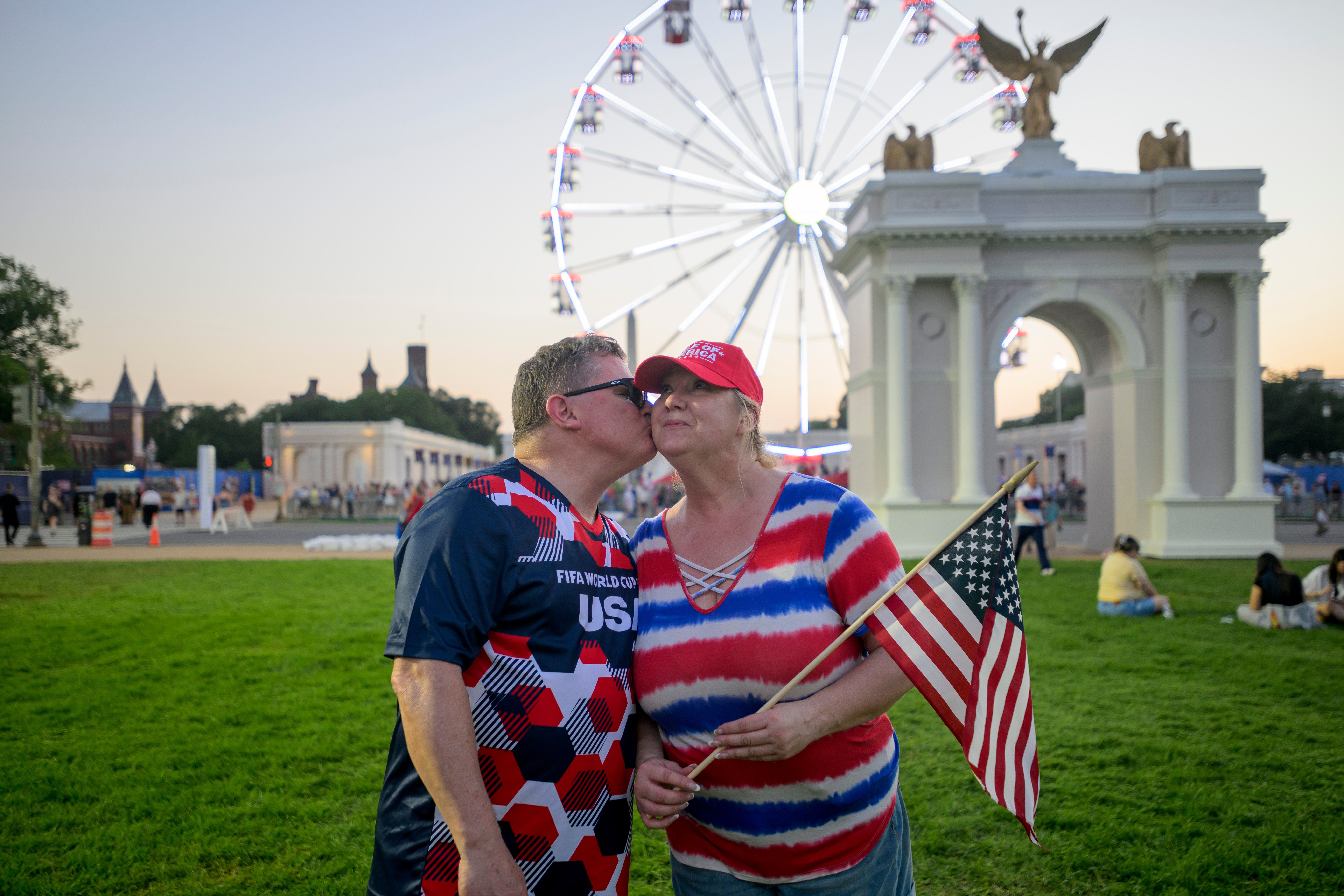 Todd Shaw kisses his wife Shannon Shaw as they pose for a portrait during the Great American State Fair on the National Mall, Thursday, in Washington. Anticipation for the celebrations has been building for months.