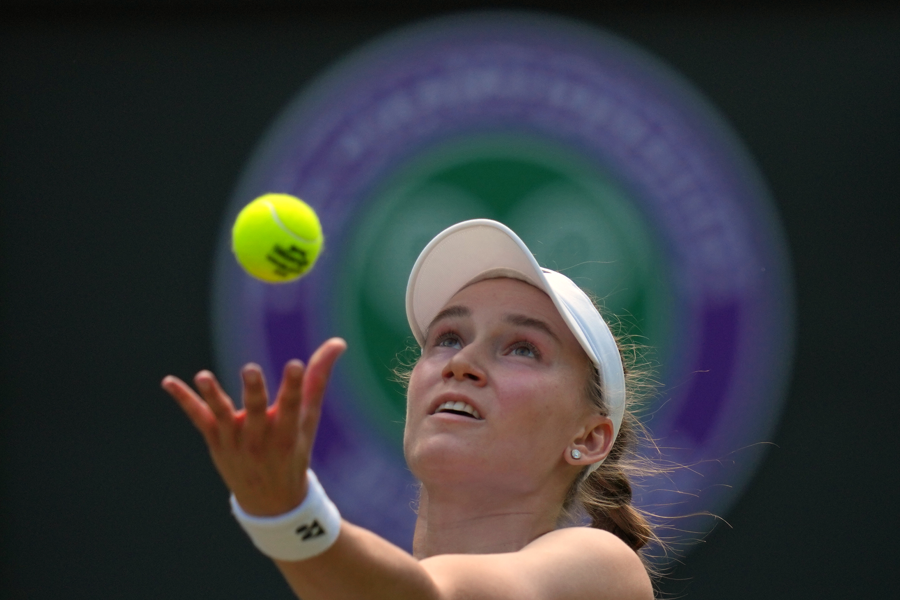 Elena Rybakina of Kazakhstan serves against Elise Mertens of Belgium in their third round women's singles match at the Wimbledon Tennis Championships in London, Saturday, July 4, 2026. 