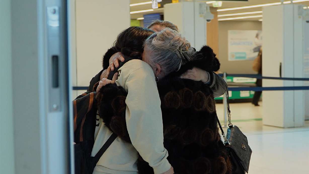 McKenna Christensen hugs her biological family at the Chișinău International Airport in Chișinău, Moldova. Christensen reunited with her family after discovering life-changing information through her biological sister.