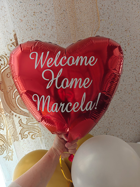 A balloon was waiting for McKenna Christensen when she arrived in Moldova. Christensen was born Marcela Ibrian.