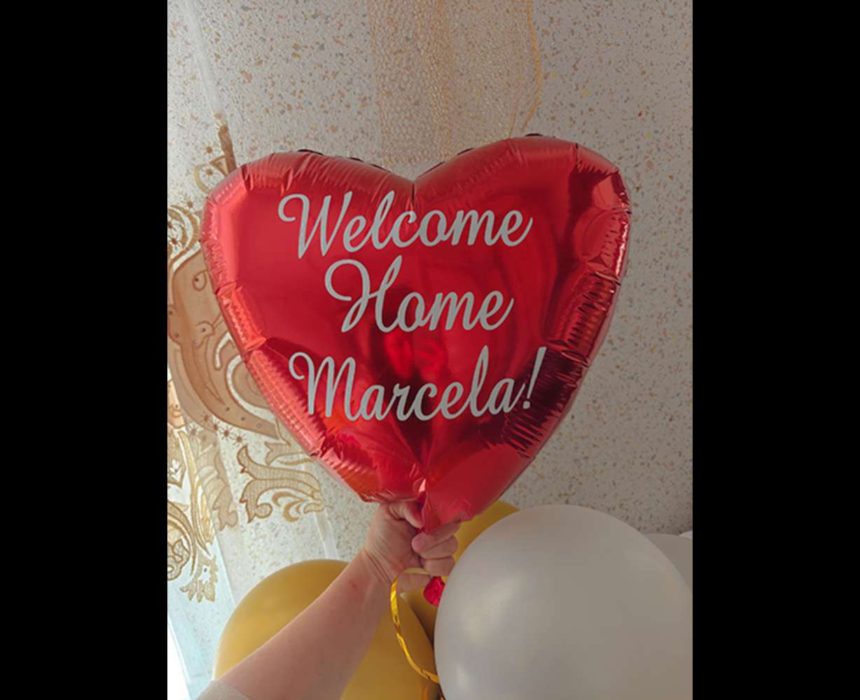 A balloon was waiting for McKenna Christensen when she arrived in Moldova. Christensen was born Marcela Ibrian.