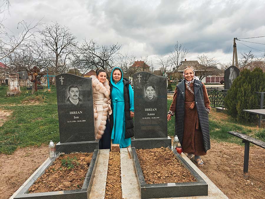 The Ibrian sisters at their parents’ graves at the cemetery. The visit came on Orthodox Easter.