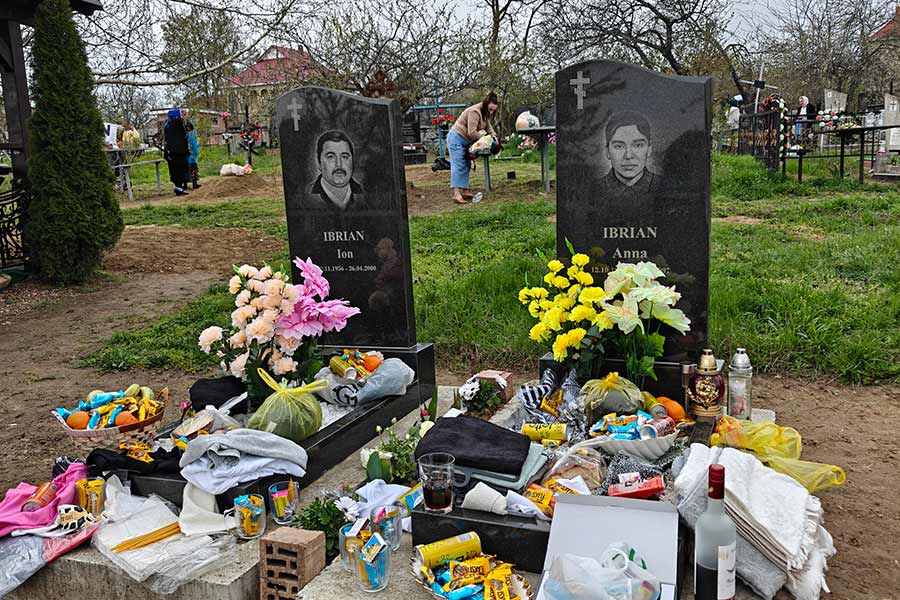 The graves of the Ibrian sisters with gifts. Decorating graves is an Orthodox Easter tradition in Moldova.