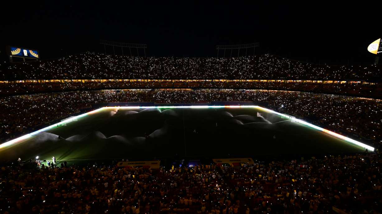 Fans take part in a light show with their mobile phones during halftime in the World Cup round of 32 soccer match between Colombia and Ghana in Kansas City, Mo., Friday, July 3, 2026.