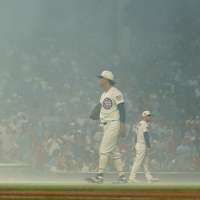 Cubs fans sing `Take Me Home, Country Roads' during fog delay at Wrigley Field
