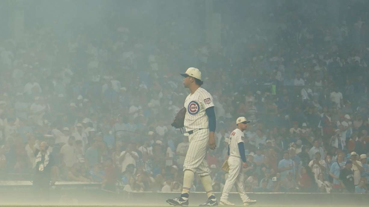 Chicago Cubs pitcher Shota Imanaga stands amidst smoke after fireworks before a baseball game against the St. Louis Cardinals, Saturday, July 4, 2026, in Chicago.
