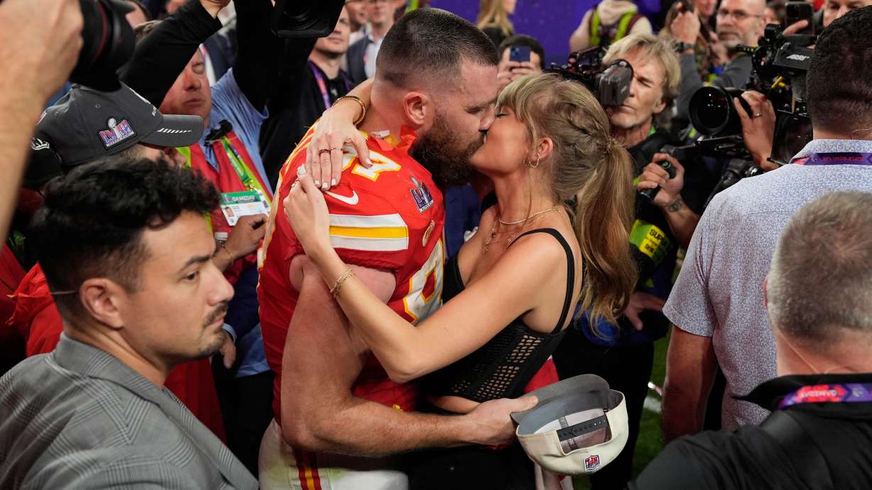 FILE - Kansas City Chiefs tight end Travis Kelce (87) kisses Taylor Swift after the Kansas City Chiefs defeated the San Francisco 49ers at the Super Bowl in Las Vegas on Feb. 11, 2024.