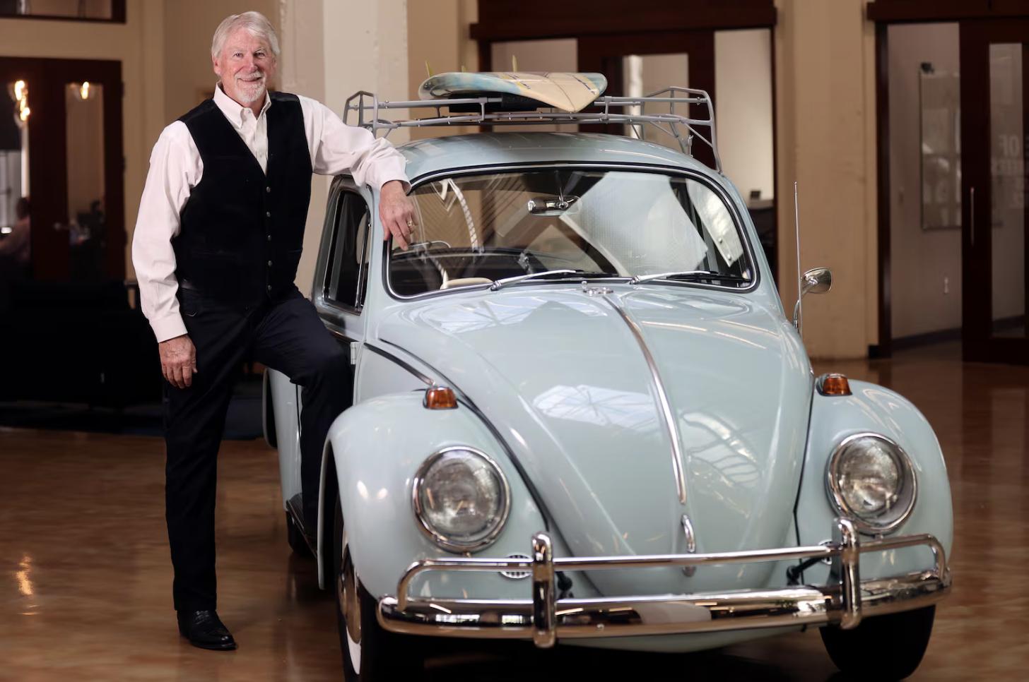 Rob Moore, Big-D executive chairman, poses for a portrait at the Big-D office in Salt Lake City on May 19. Moore has been with the company for 50 years. In 1967, Dee Livingood sold his blue Volkswagen for $1,000 to fund the launch of Big-D. Now a blue Volkswagen is in the lobby of the Big-D office.