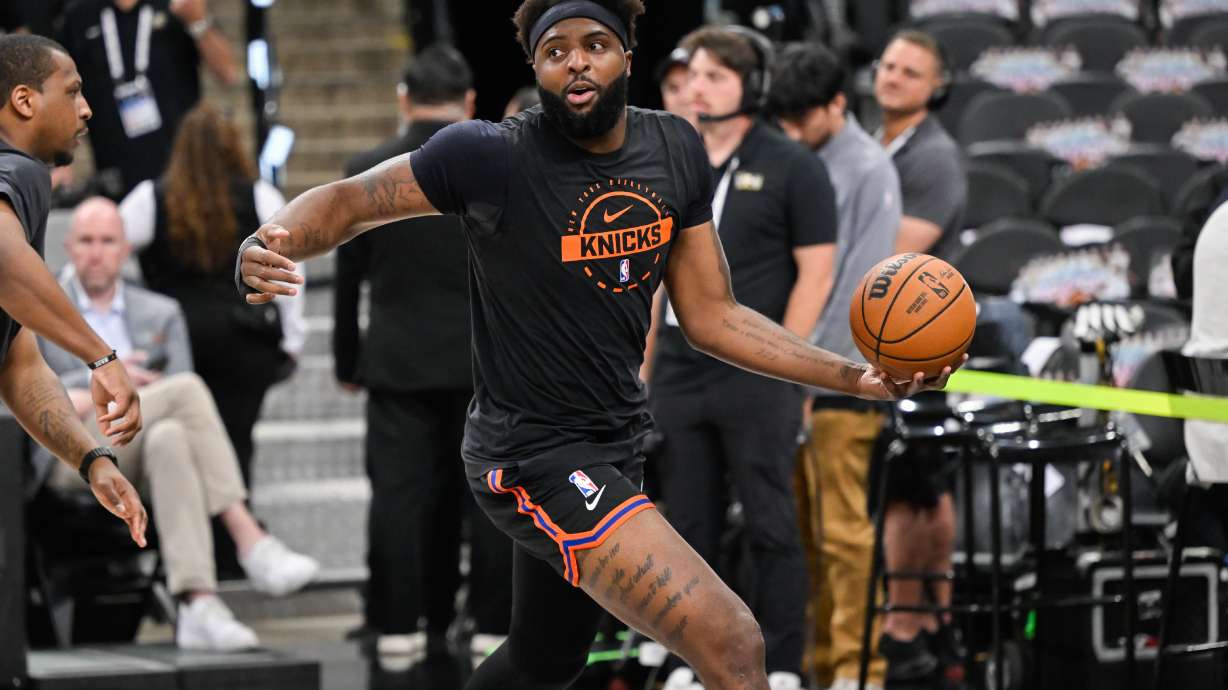 New York Knicks center Mitchell Robinson warms up prior to Game 5 of the NBA Finals basketball series against the San Antonio Spurs, Saturday, June 13, 2026, in San Antonio.