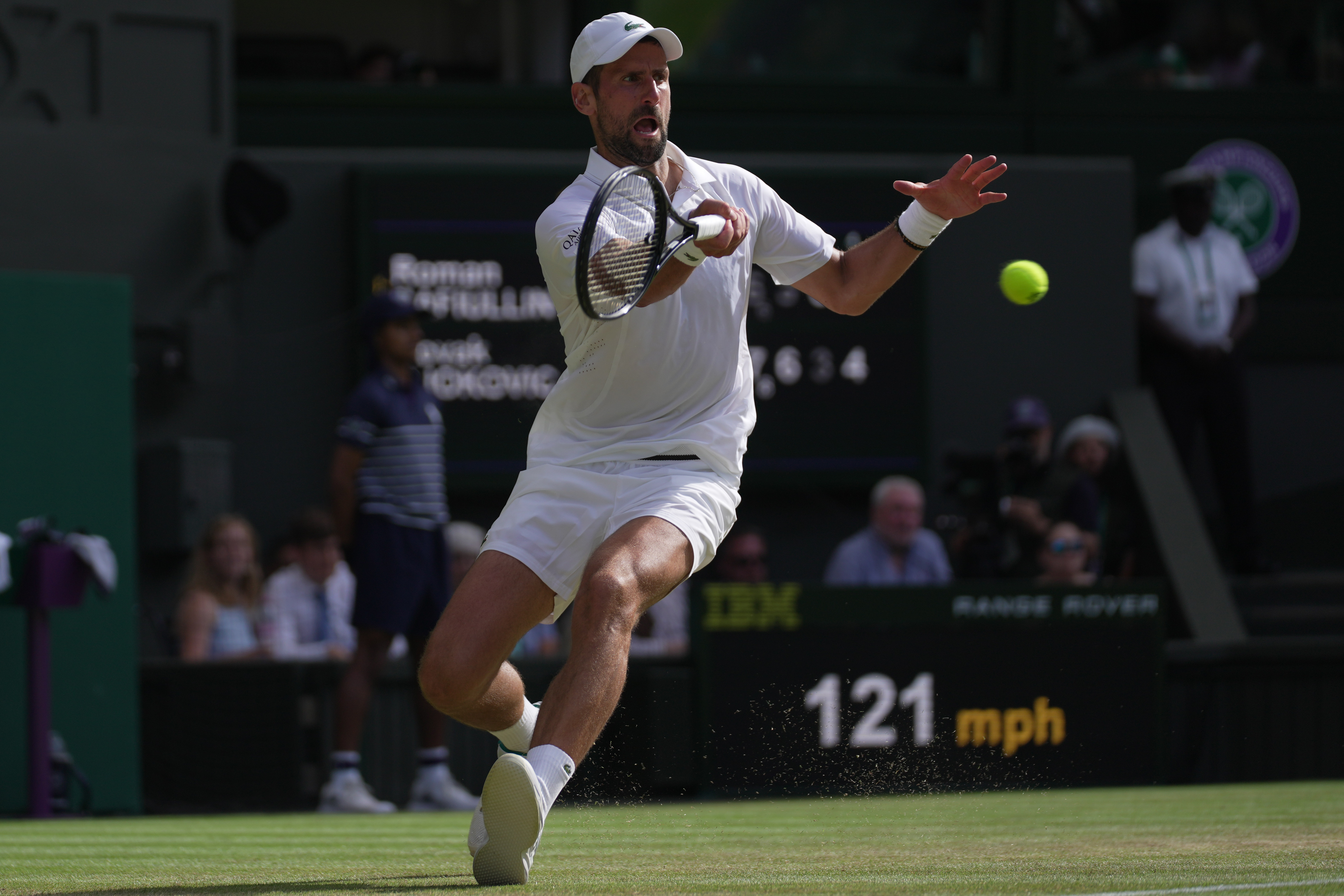 Novak Djokovic of Serbia returns the ball to Roman Saffiulin of Russia in their fourth round men's singles match at the Wimbledon Tennis Championships in London, Sunday, July 5, 2026. 