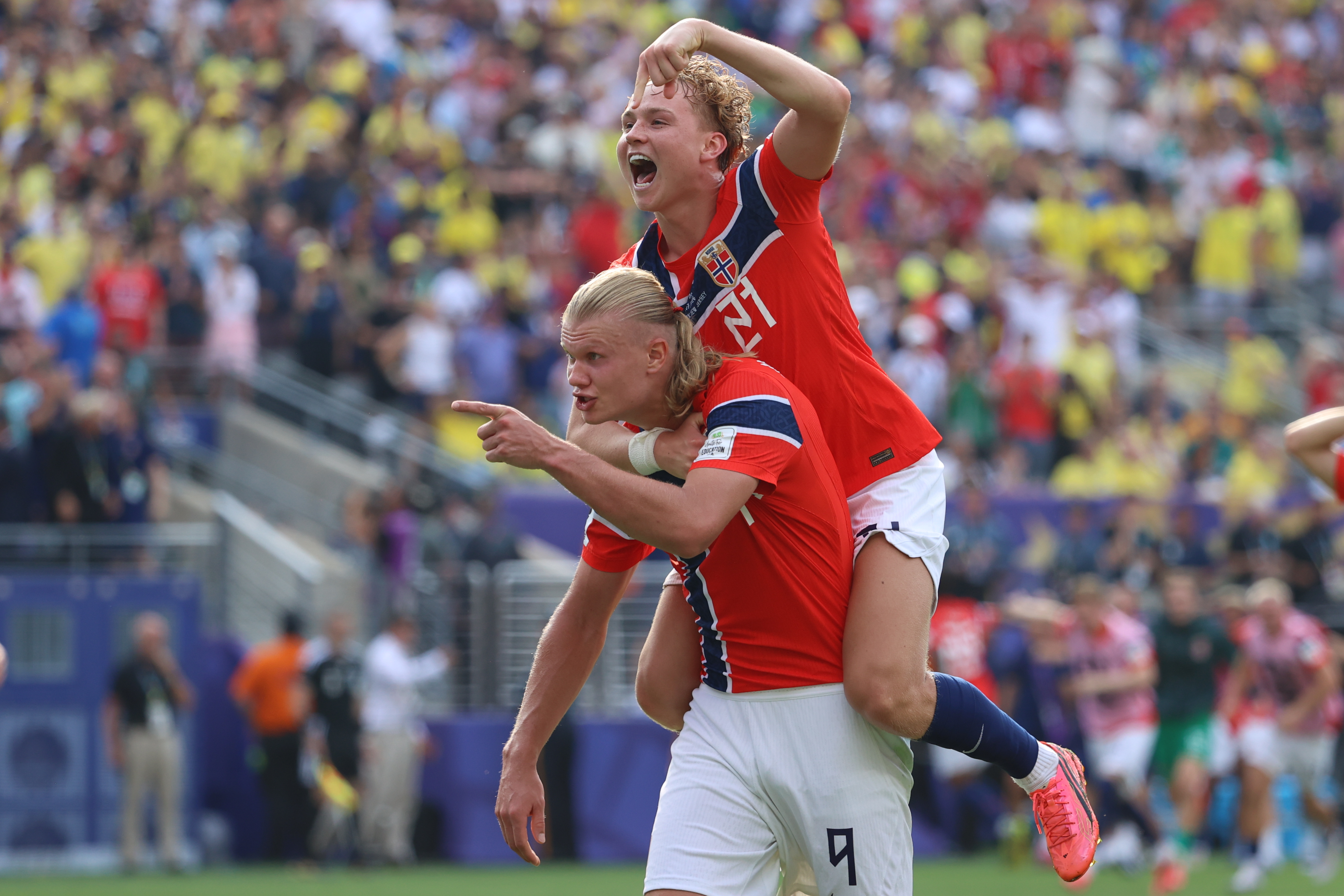 Norway's Erling Haaland (9) celebrates with Andreas Schjelderup (21) after scoring their second goal during the World Cup round of 16 soccer match between Brazil and Norway in East Rutherford, N.J., near New York, Sunday, July 5, 2026. 