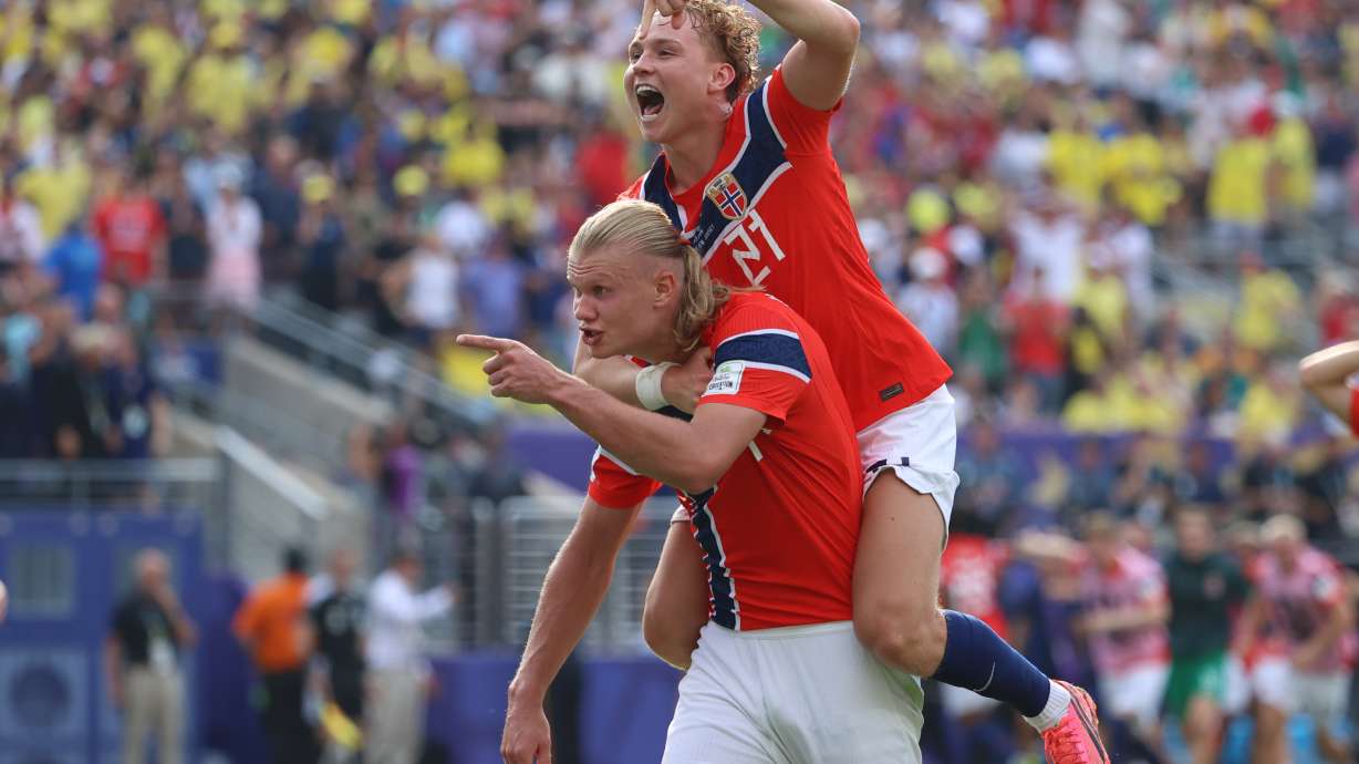 Norway's Erling Haaland (9) celebrates with Andreas Schjelderup (21) after scoring their second goal during the World Cup round of 16 soccer match between Brazil and Norway in East Rutherford, N.J., near New York, Sunday, July 5, 2026.