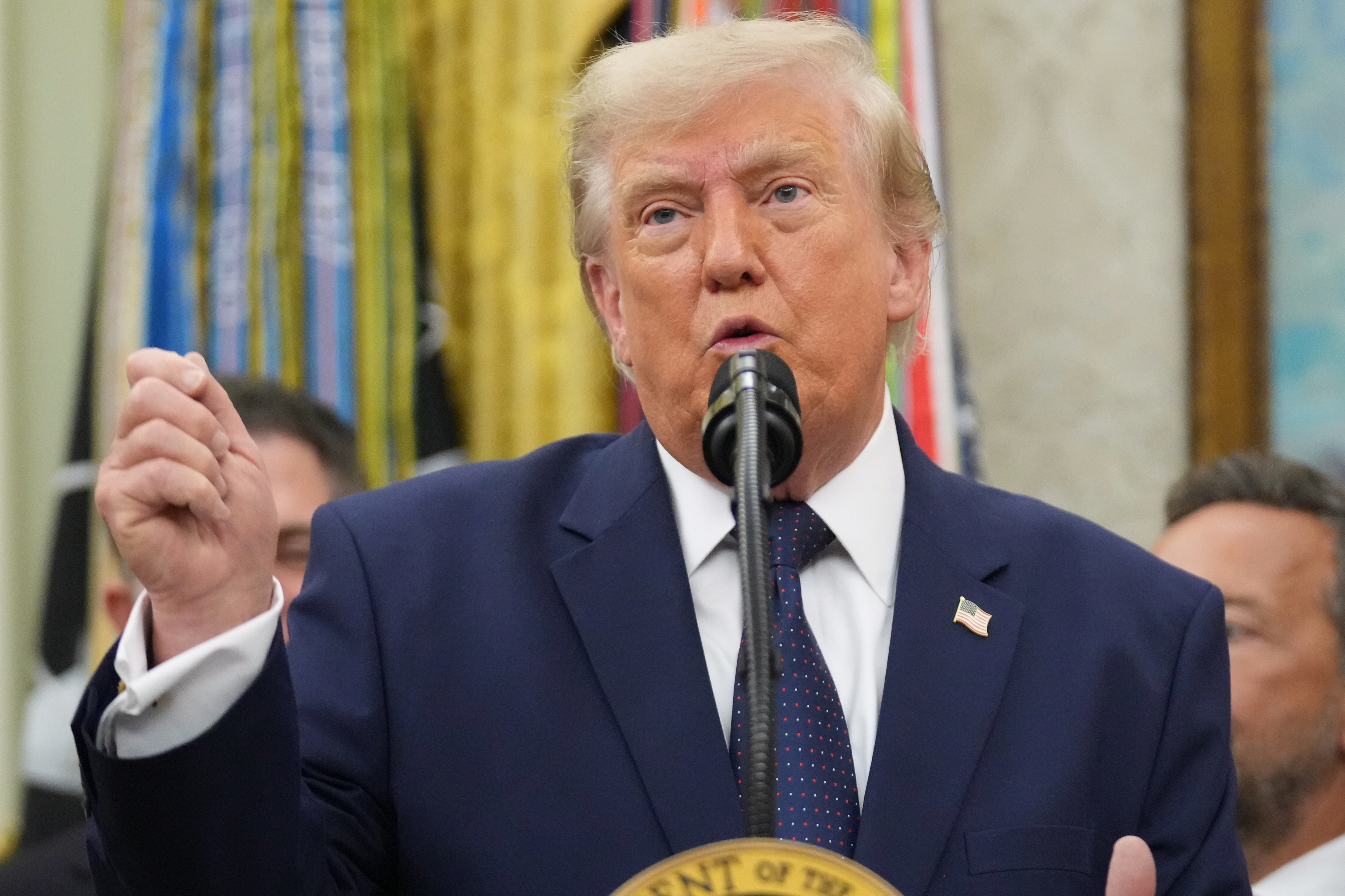 President Donald Trump speaks about FIFA after ringing the opening bell for the New York Stock Exchange and the Nasdaq in the Oval Office at the White House, Monday, July 6, 2026, in Washington. 