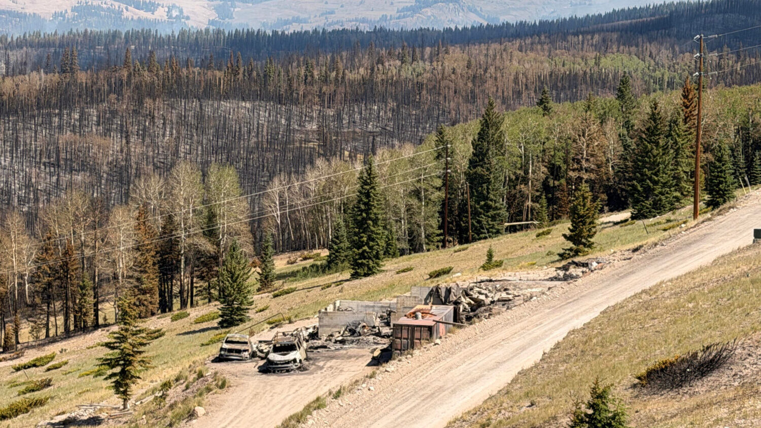 Charred remains of houses and vehicles are all that is left in Eagle Point Resort’s West Village outside of Beaver Tuesday, June 30, 2026, after the Cottonwood Fire torched much of the area.