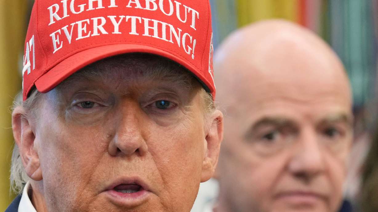 FILE - President Donald Trump speaks as FIFA President Gianni Infantino listens in the Oval Office of the White House, Friday, Aug. 22, 2025, in Washington.