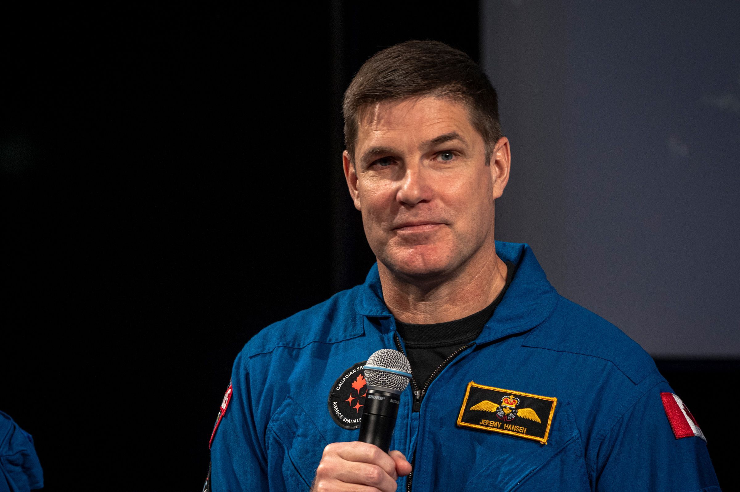 Canadian astronaut Jeremy Hansen, mission specialist for Artemis II, speaks at the Canadian Space Agency headquarters in May. Hansen said Monday that he is stepping back from a full-time astronaut role in September.