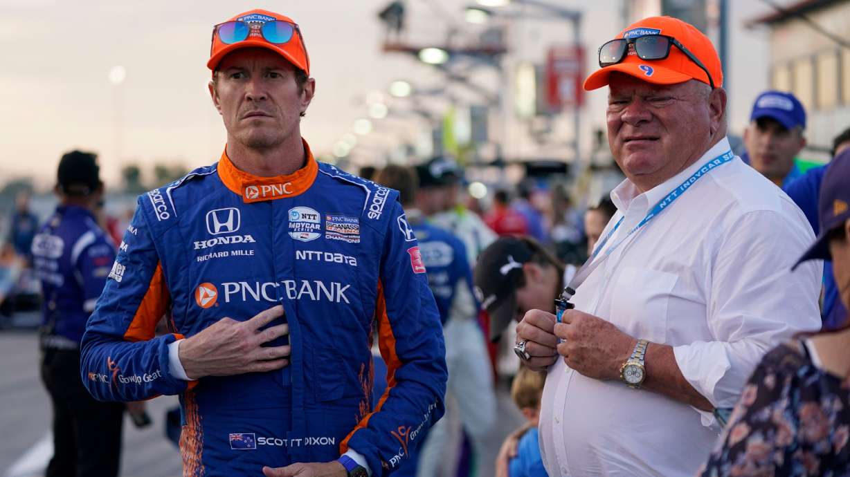 FILE - Scott Dixon, left, stands next to Chip Ganassi before the start an IndyCar auto race at World Wide Technology Raceway on Aug. 21, 2021, in Madison, Ill.