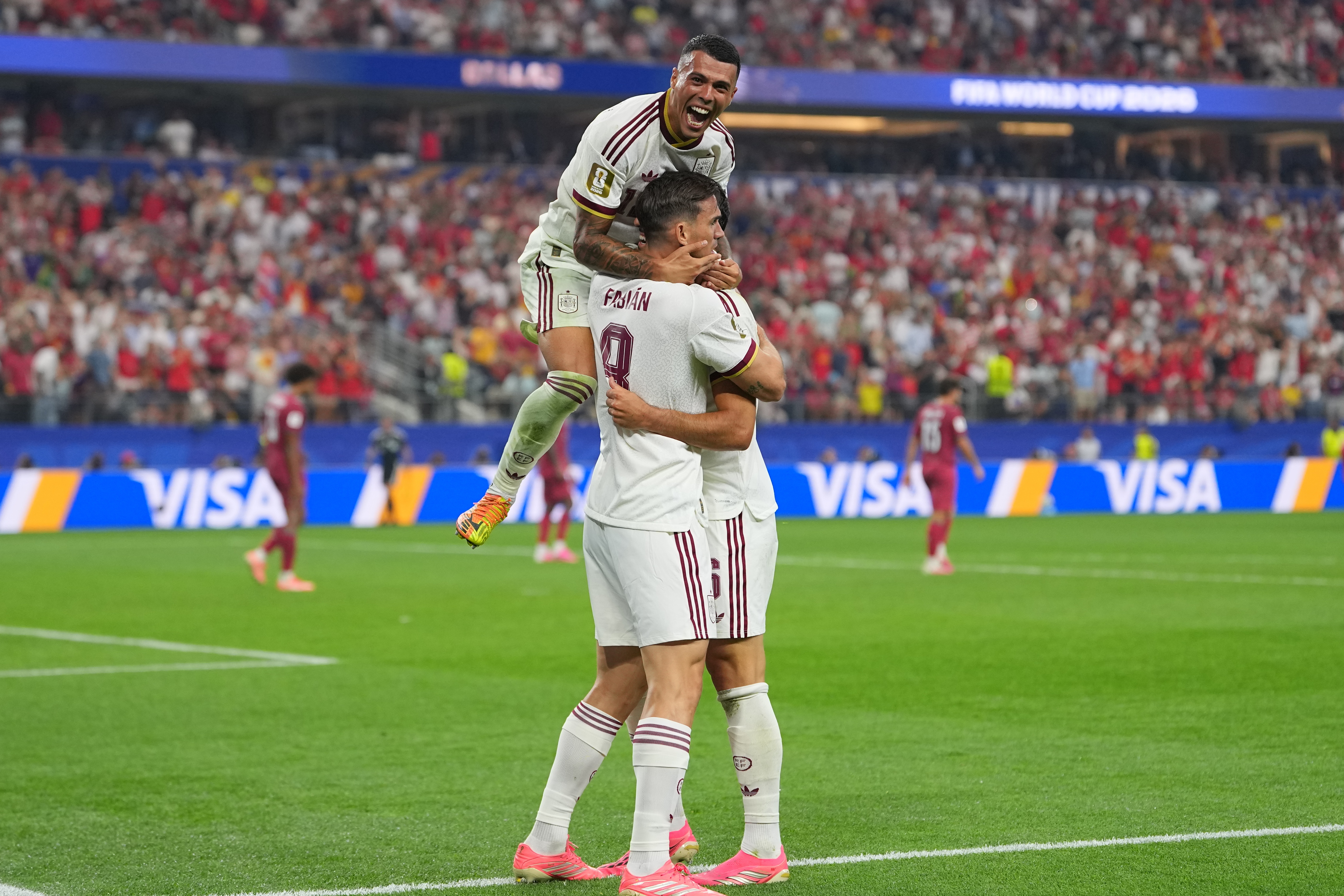 Spain's Pedro Porro, top, congrats Spain's Mikel Merino, right, after scored during the World Cup round of 16 soccer match between Portugal and Spain in Arlington, Texas, near Dallas, Monday, July 6, 2026. 