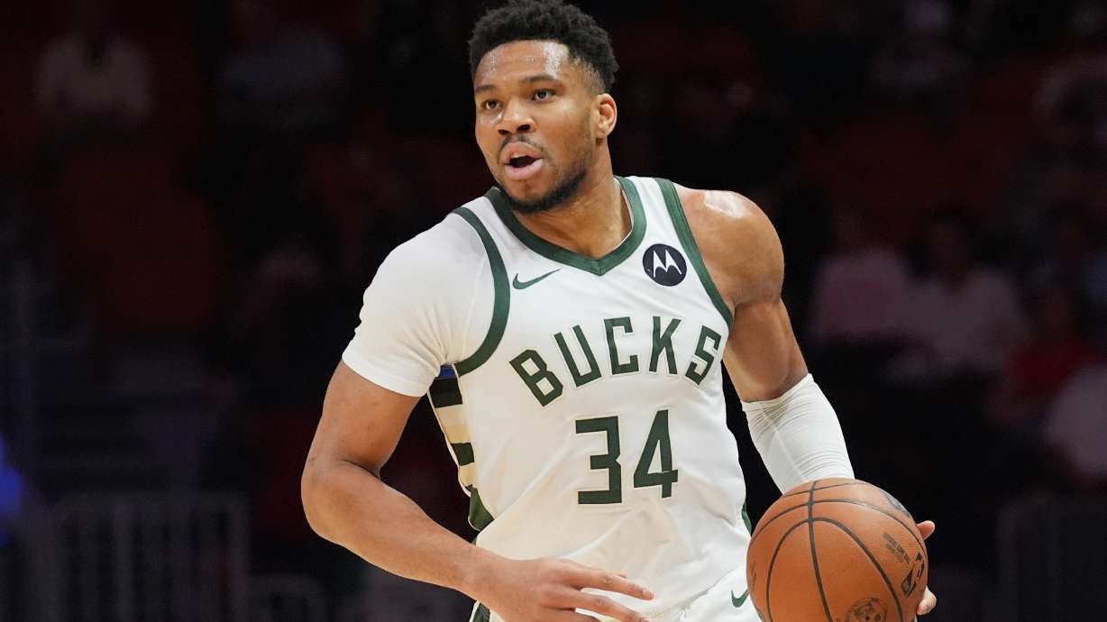 FILE - Milwaukee Bucks forward Giannis Antetokounmpo (34) dribbles the ball during the first half of an NBA basketball game against the Miami Heat, March 12, 2026, in Miami.