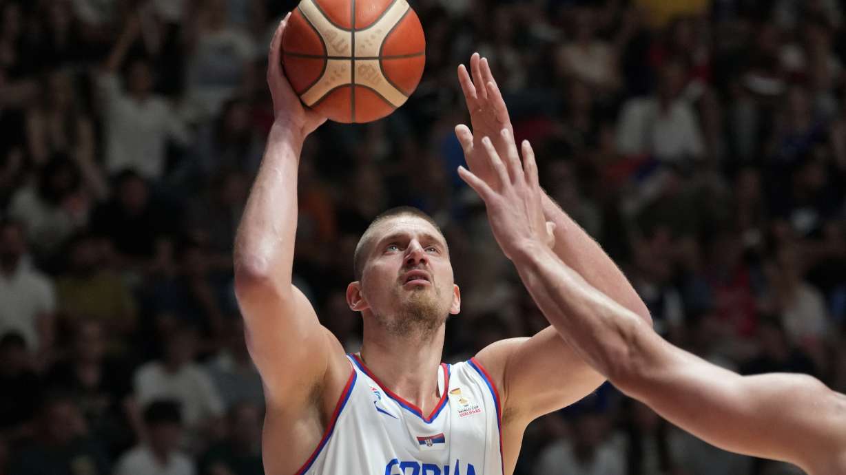 Serbia's Nikola Jokic tries to score as Bosnia's Luka Garza blocks him during their FIBA Basketball World Cup 2027 European qualifiers match between Serbia and Bosnia, in Belgrade, Serbia, Monday, July 6, 2026.