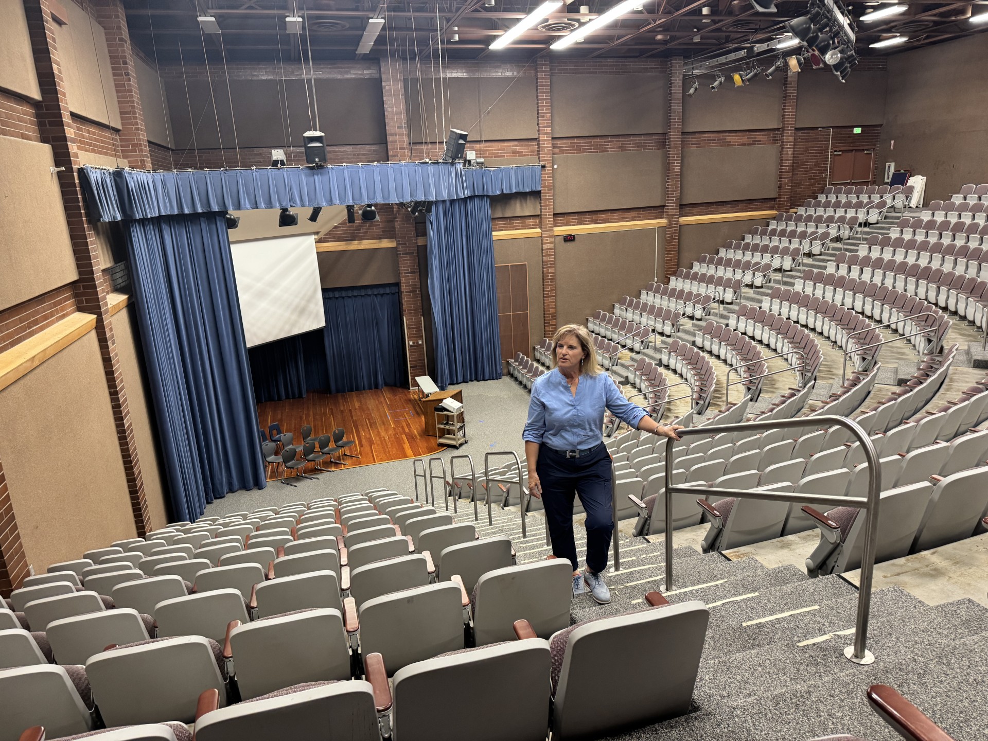 Sandy Mayor Monica Zoltanski inside the auditorium of the former Crescent View Middle School on Monday.