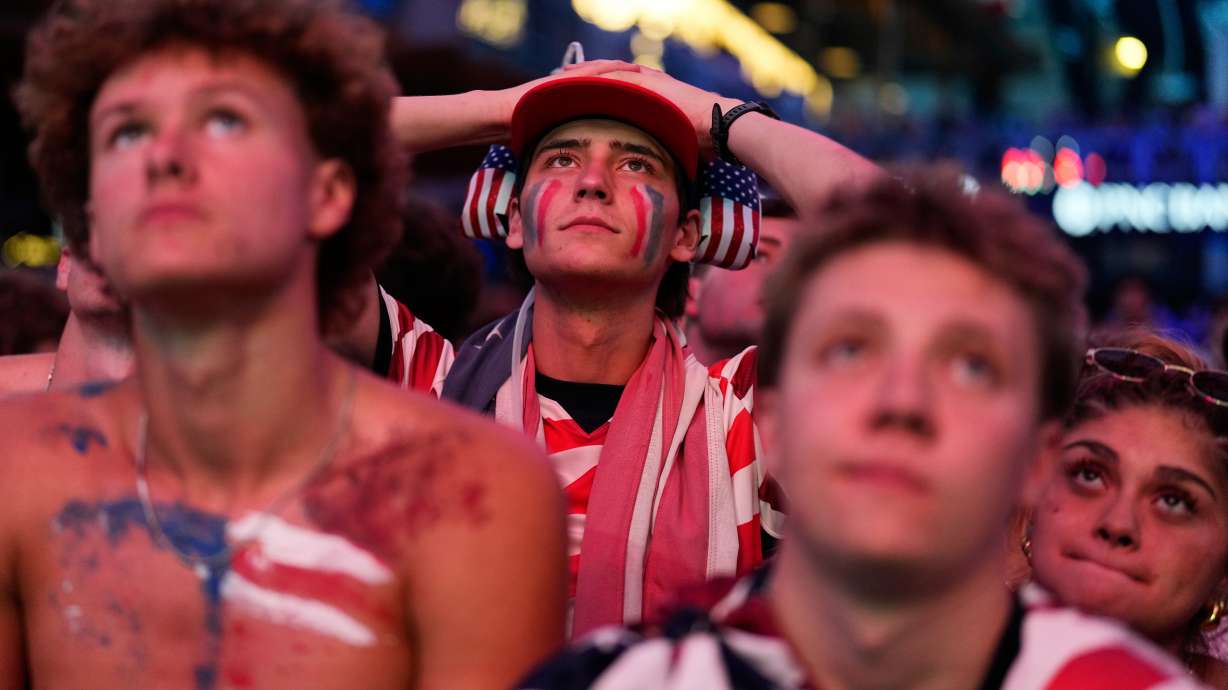 Fans react to a United States loss during a watch party for a World Cup round of 16 soccer match between the United States and Belgium at the KC Live! entertainment district Monday, July 6, 2026, in Kansas City, Mo.