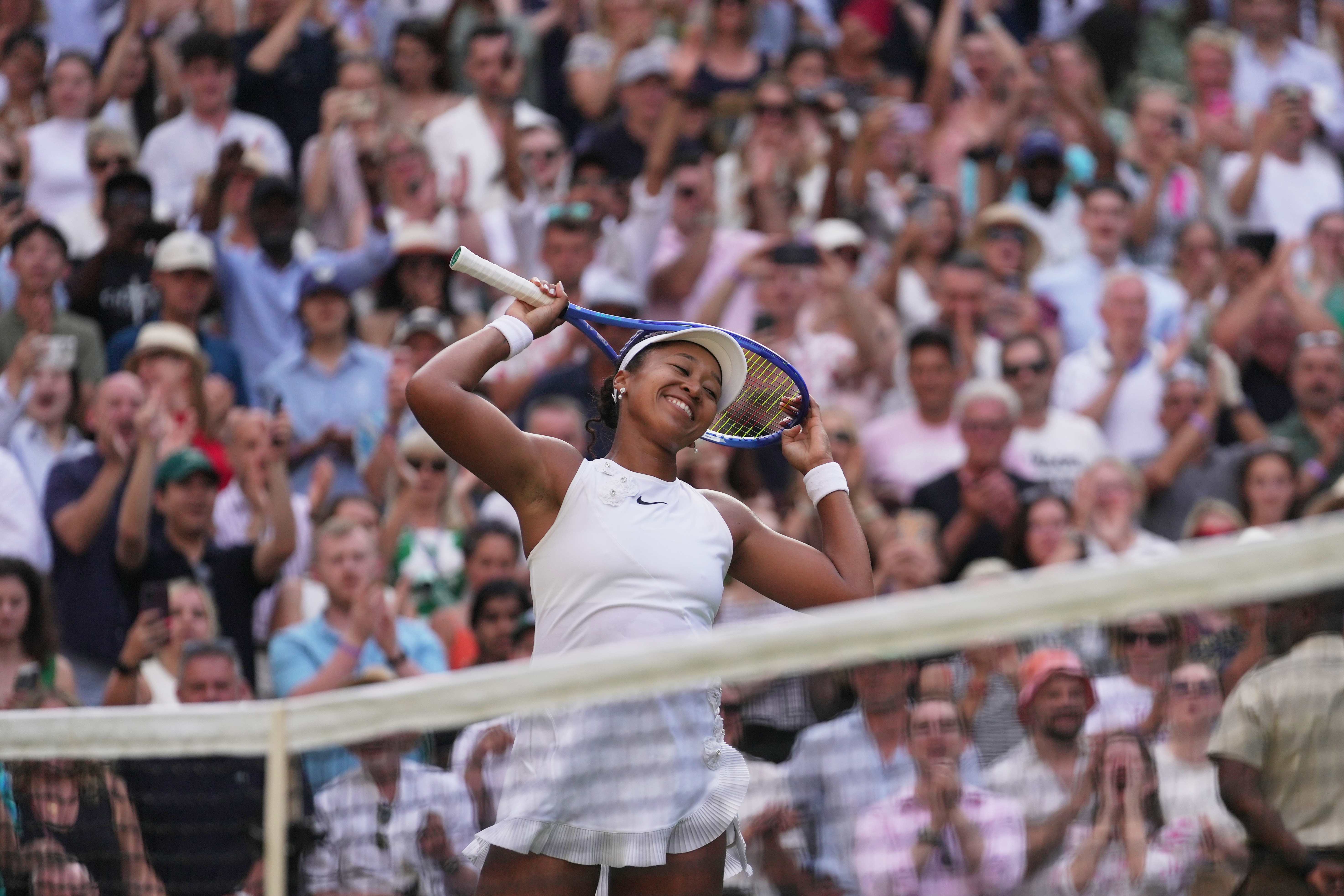 Naomi Osaka of Japan celebrates her victory against Aryna Sabalenka of Belarus in their fourth round women's singles match at the Wimbledon Tennis Championships in London, Sunday, July 5, 2026. 