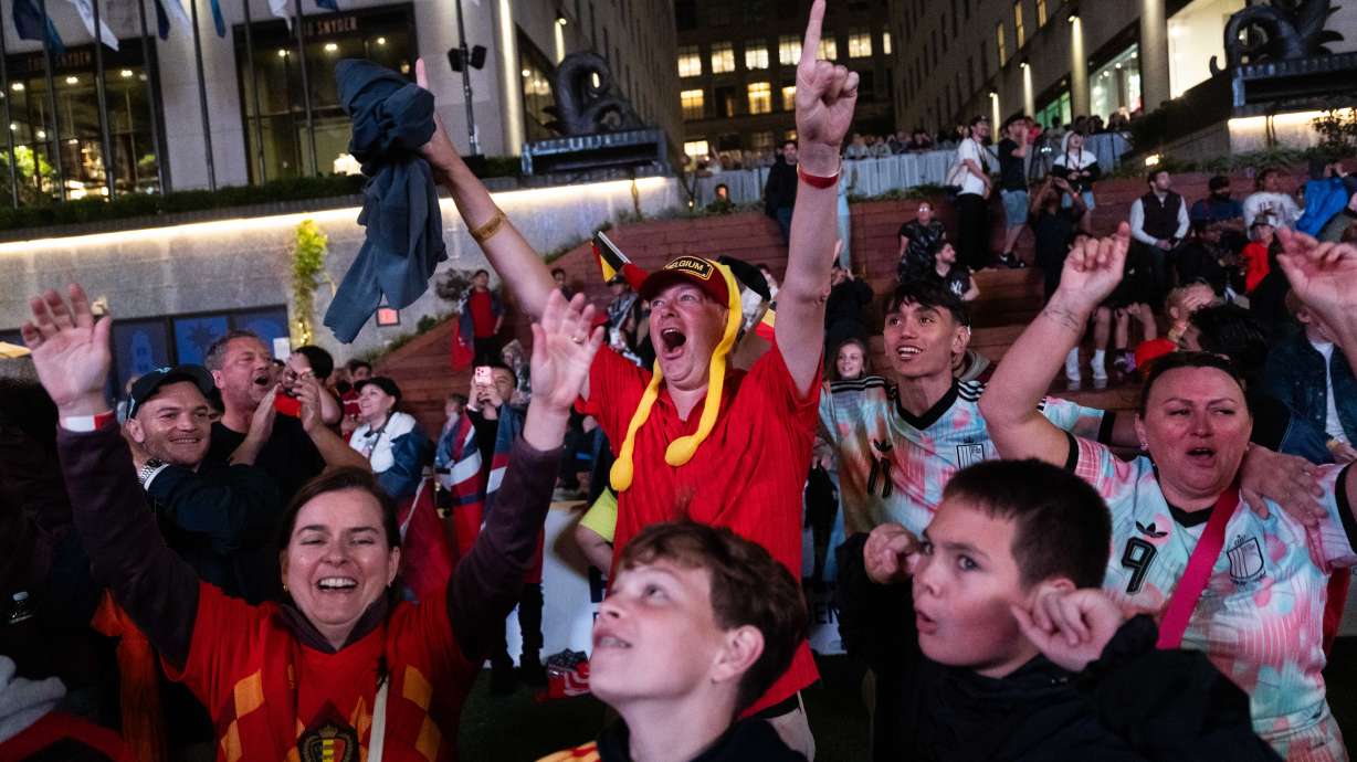 Belgium fans react after the team scored during the World Cup round of 16 soccer match between the United States and Belgium, at a watch party at the Rockefeller Center fan village, Monday, July 6, 2026, in New York.