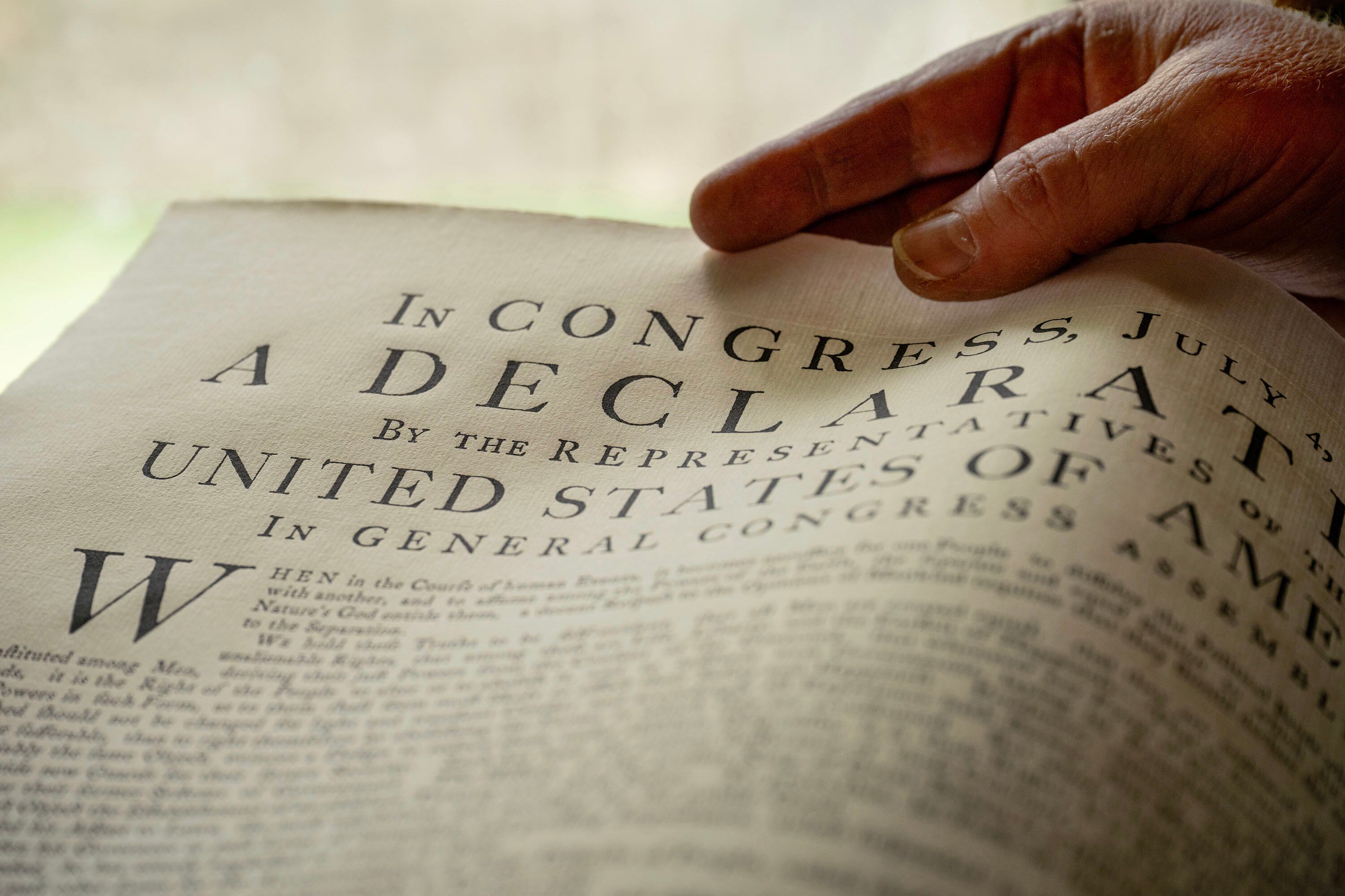Paper artist Robert Buchert displays his recreation of the Declaration of Independence in his Provo workshop on May 29.