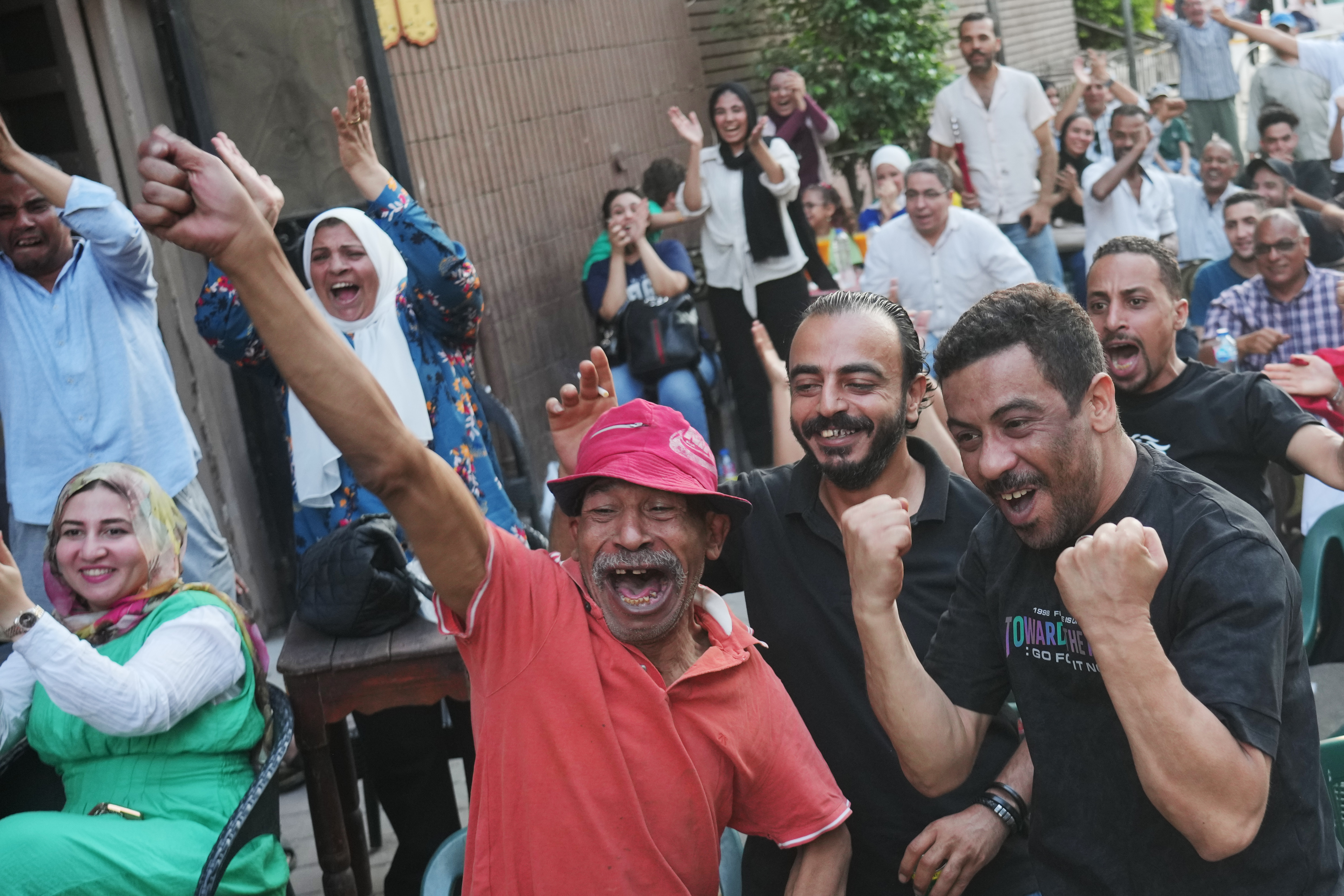 A Cairo coffee house erupts, then goes silent as Egypt's World Cup run meets Argentina