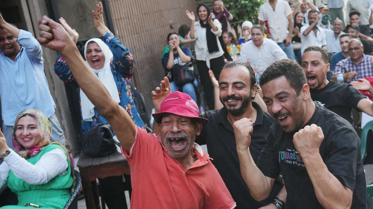 Fans celebrate Egypt's goal on Argentina during a watch party for the World Cup knockout stage, in Cairo, Egypt, Tuesday, July 7, 2026.