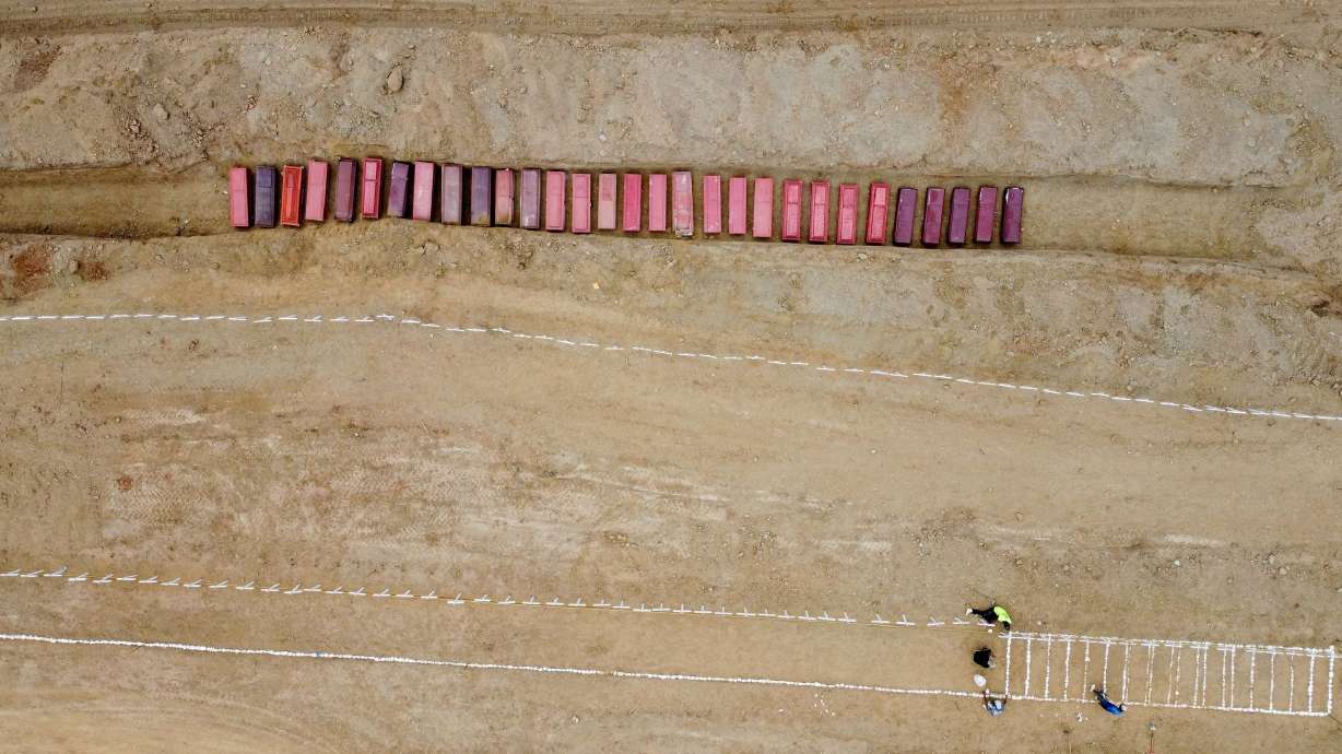 A drone view of coffins on the day of the burial of earthquake victims, in the aftermath of the June 24 earthquakes, at La Esperanza Cemetery, in La Guaira, Venezuela, on Monday.