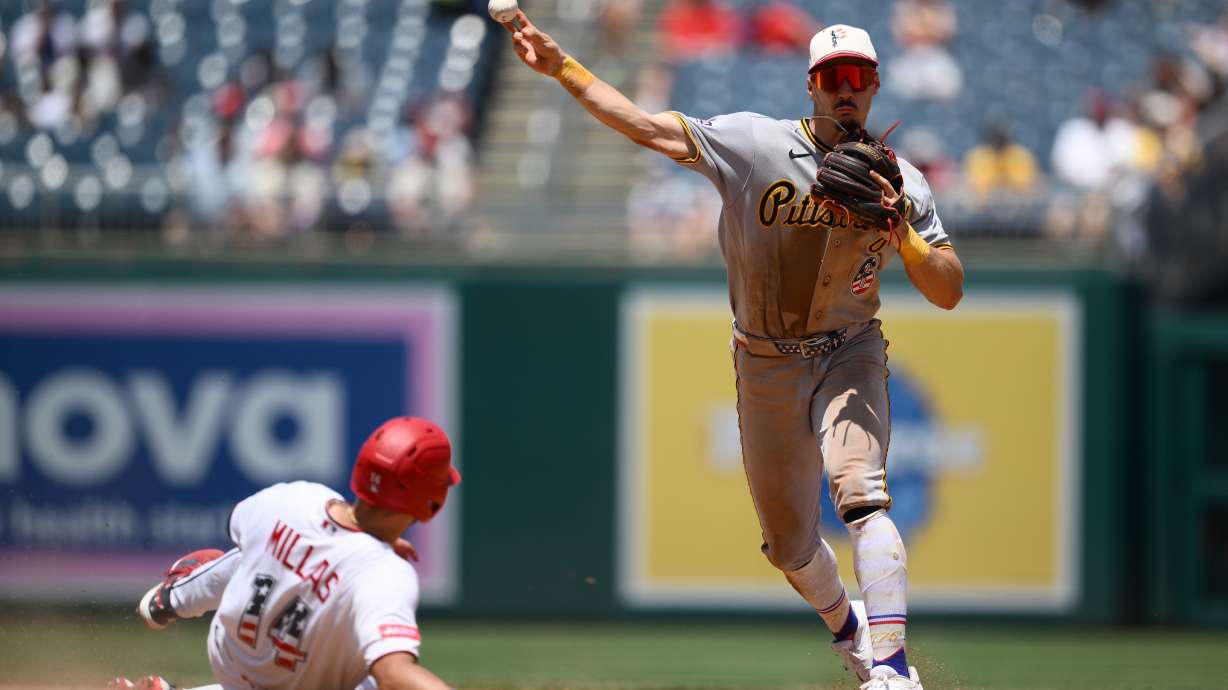 Washington Nationals' Drew Millas is out at second base as Pittsburgh Pirates shortstop Konnor Griffin throws to first base to put out Nationals' Nasim Nunez during the seventh inning of a baseball game, Saturday, July 4, 2026, in Washington.