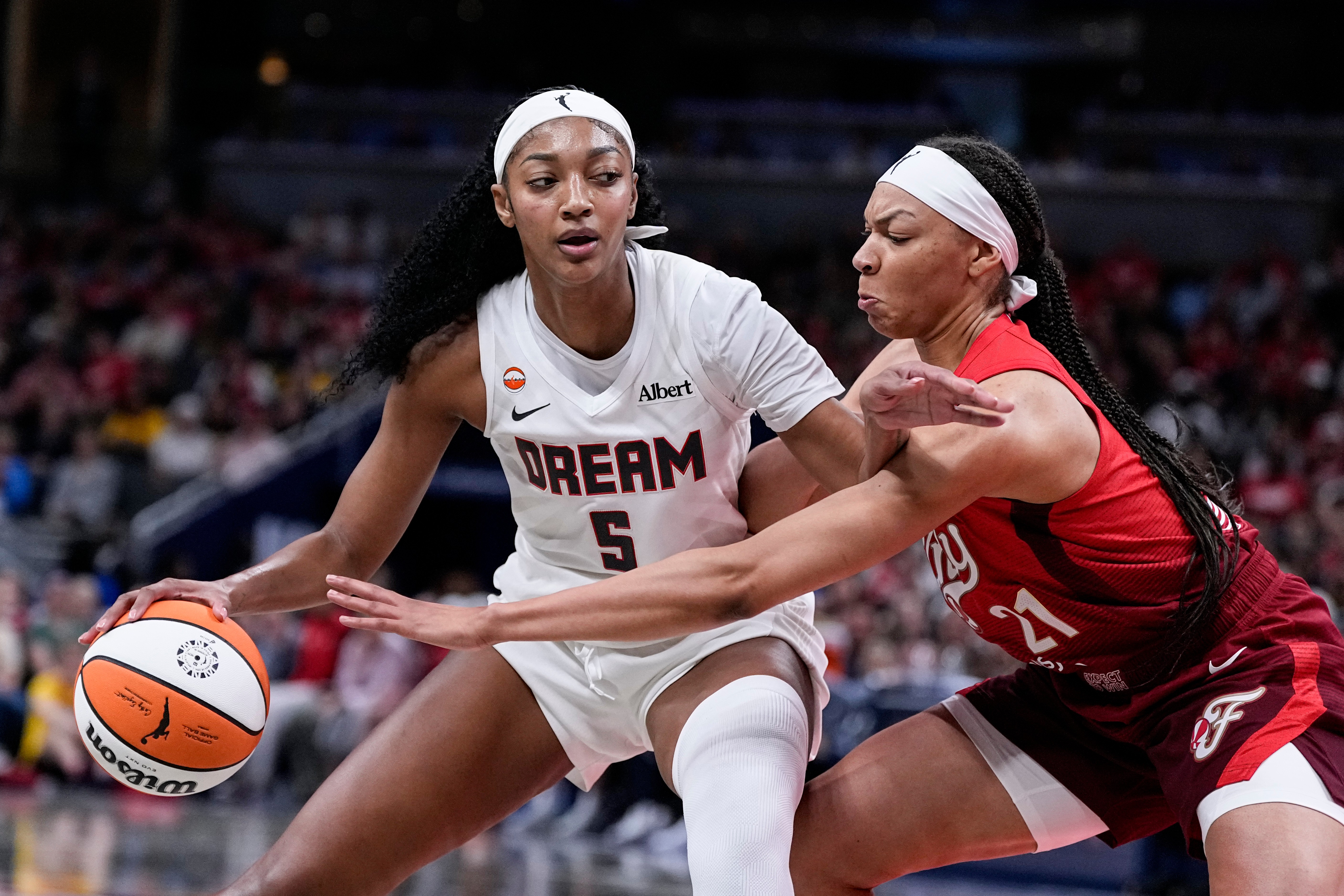 Indiana Fever forward Makayla Timpson (21) defends Atlanta Dream forward Angel Reese (5) in the second half of a WNBA basketball game in Indianapolis, Thursday, June 18, 2026. 