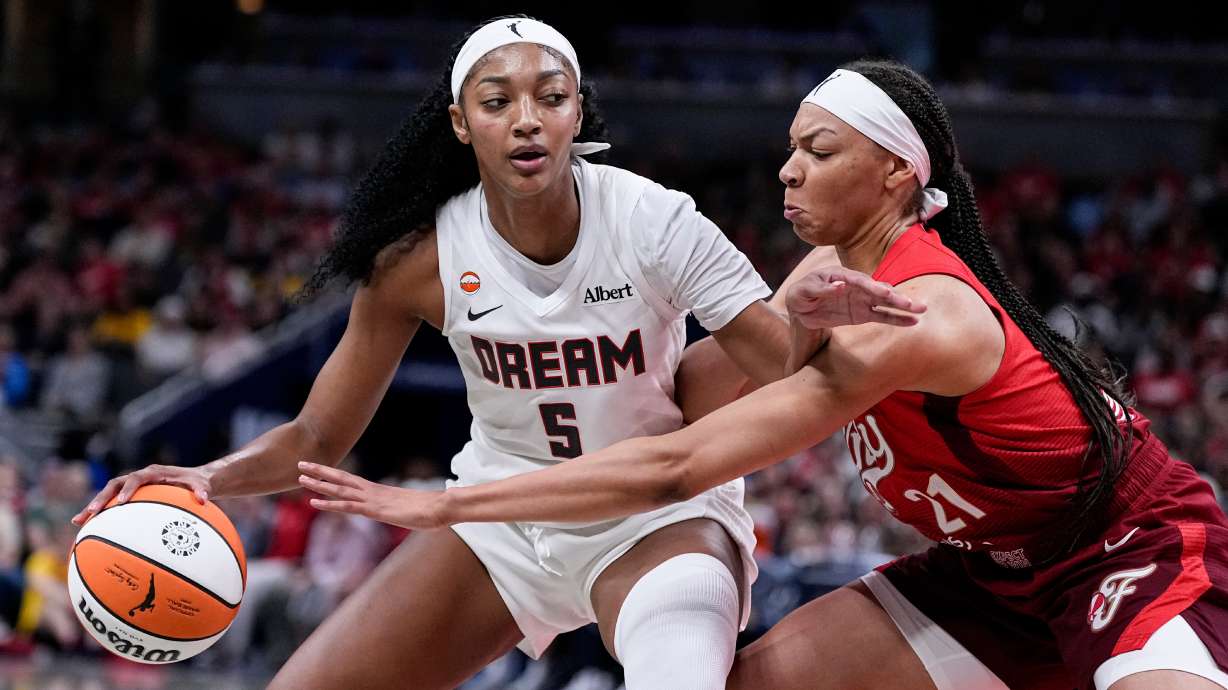Indiana Fever forward Makayla Timpson (21) defends Atlanta Dream forward Angel Reese (5) in the second half of a WNBA basketball game in Indianapolis, Thursday, June 18, 2026.