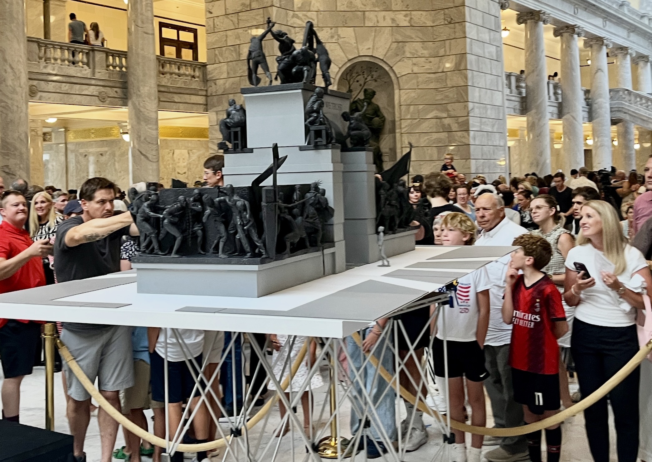 A crowd gathers at the Utah Capitol to get a better view of a model of the Grand Liberty Arch on July 6. The artist behind the sculpture said Tuesday that he'll look for a new location beyond the Utah Capitol following neighborhood pushback.
