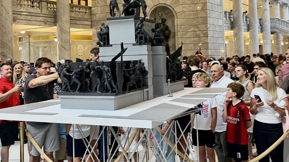 A crowd gathers at the Utah Capitol to get a better view of a model of the Grand Liberty Arch on July 6. The artist behind the sculpture said Tuesday that he'll look for a new location beyond the Utah Capitol following neighborhood pushback.