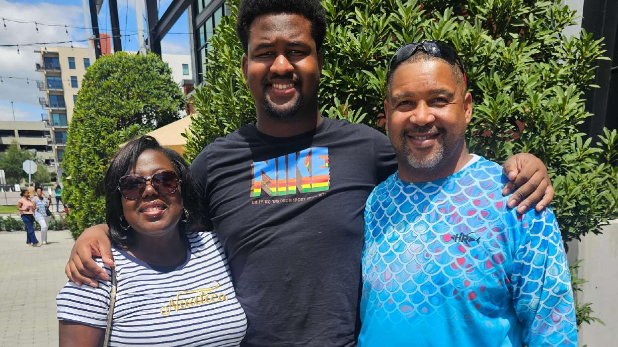 Calvin Dickey Jr., center, poses for a photo with his father, Calvin Dickey Sr., and mother, Nicole Dickey, in Tampa, Fla., on March 31, 2024.